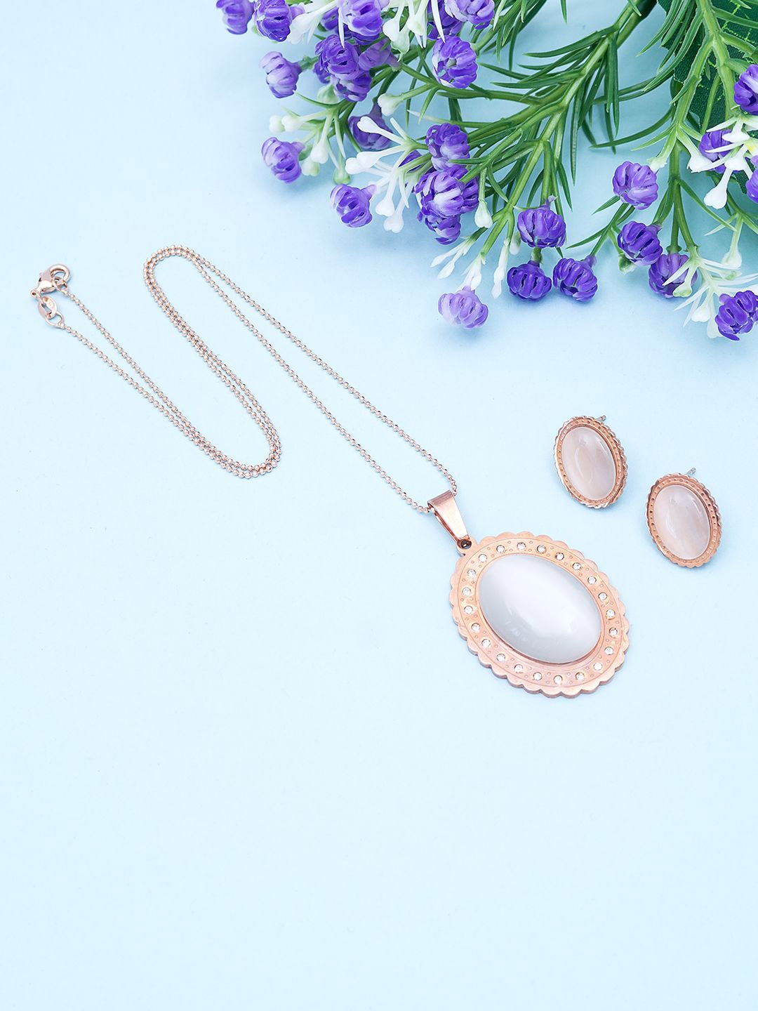 

Golden Peacock Rose Gold-Plated Stone Studded Pendant and Earrings