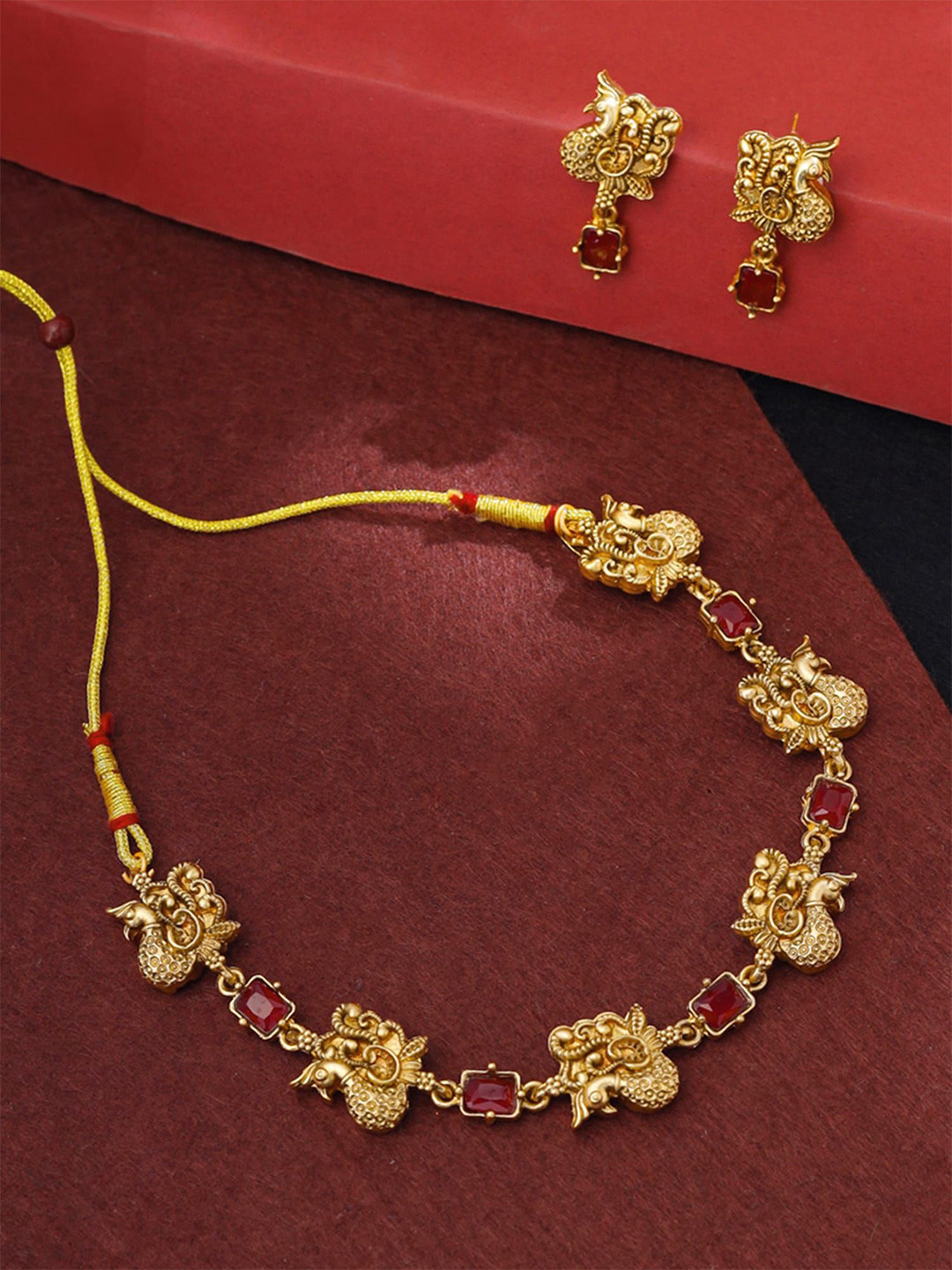 

Yellow Chimes Gold-Plated Stone-Studded Peacock-Shaped Jewellery Set