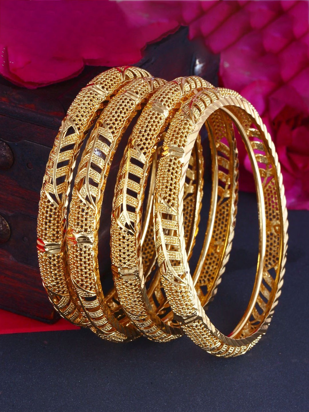 

Vighnaharta Set Of 4 Gold Plated Textured Bangles