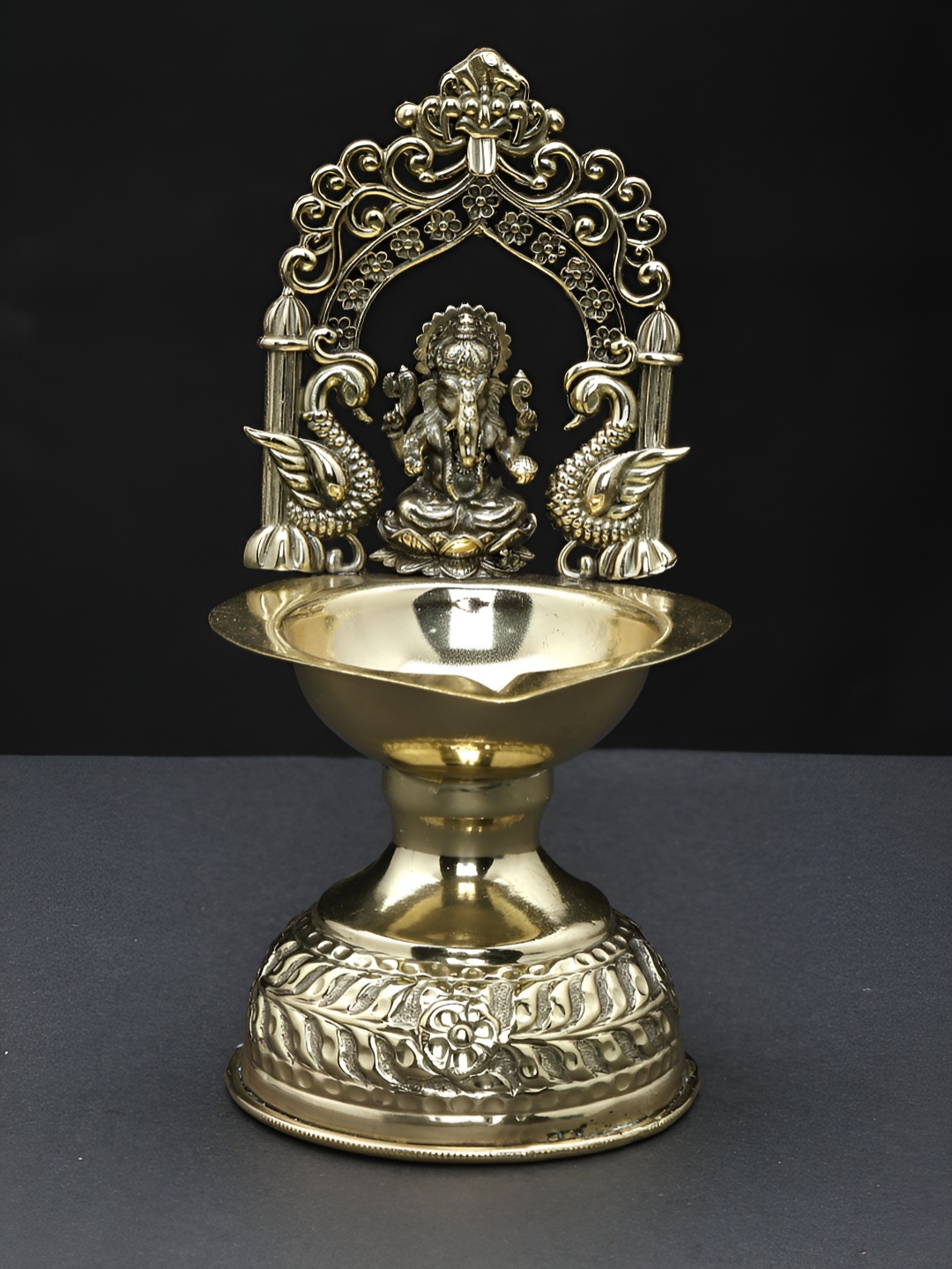 

Exotic India Brass Lord Ganesha Oil Lamp with Kirtimukha Arch, Gold