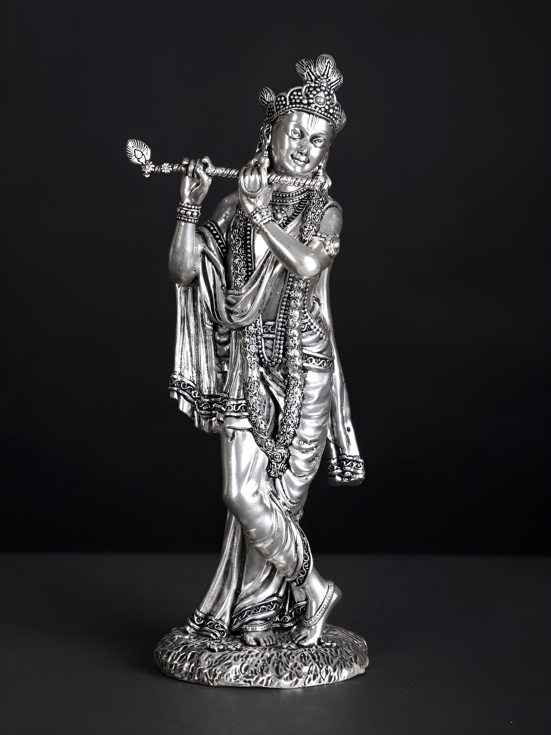 

Exotic India Silver-Plated Brass Lord Krishna Idol Playing Flute