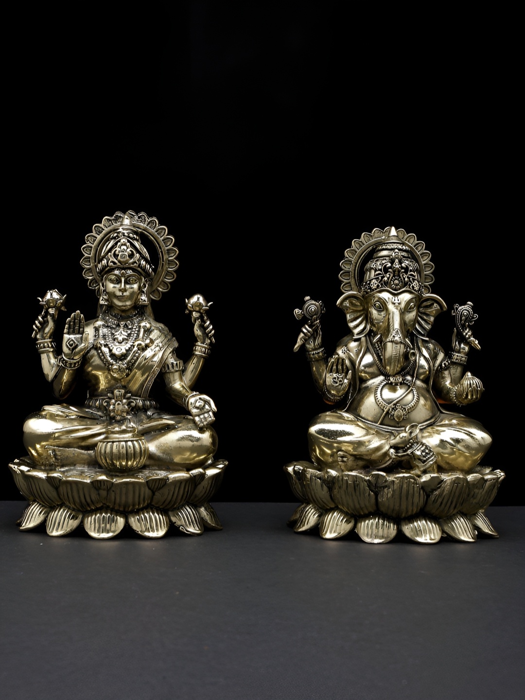 

Exotic India 4" Small Superfine Pair of Ganesha Lakshmi Seated on Lotus - Brass Statues, Gold