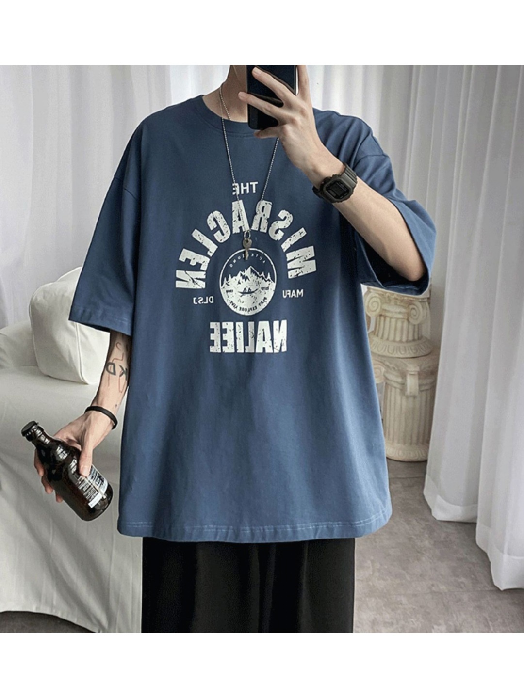 

StyleCast x Revolte Men Typography Printed Round Neck Oversized T-shirt, Blue