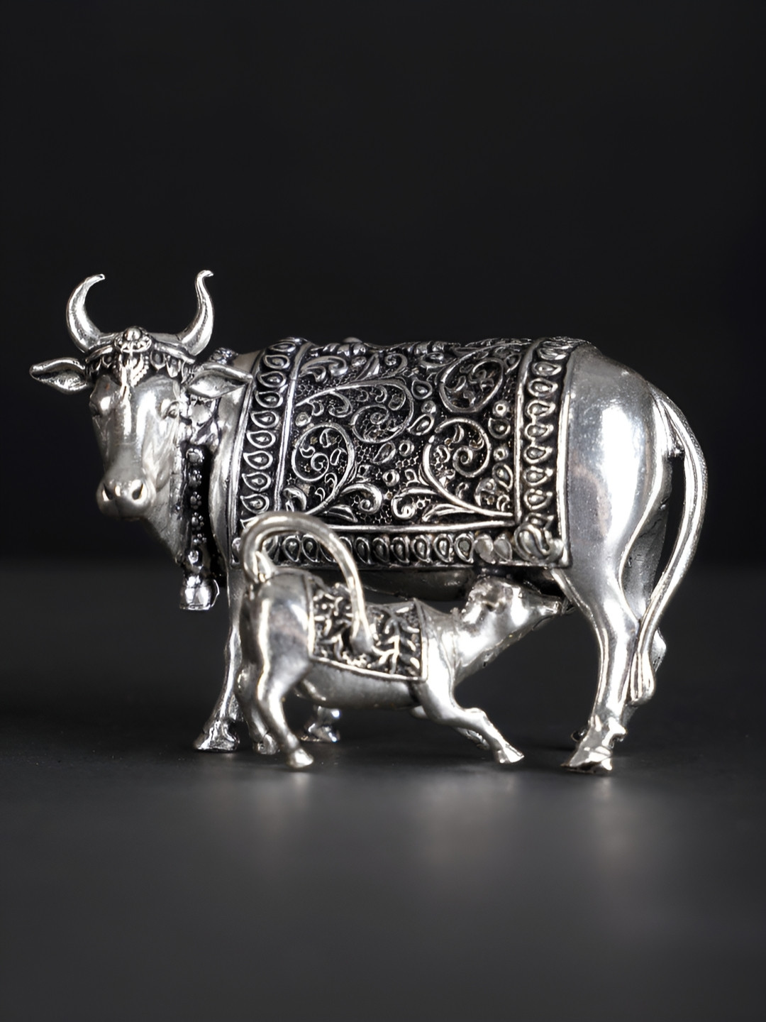 

Exotic India Silver Plated Brass Cow and Calf Statue