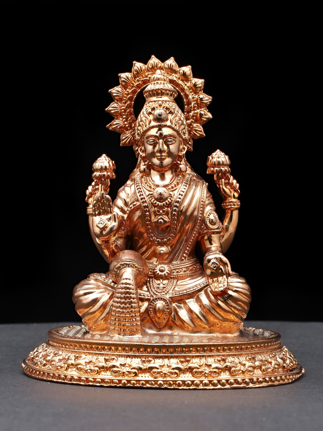 

Exotic India Gold Toned Goddess Lakshmi Idol Showpiece