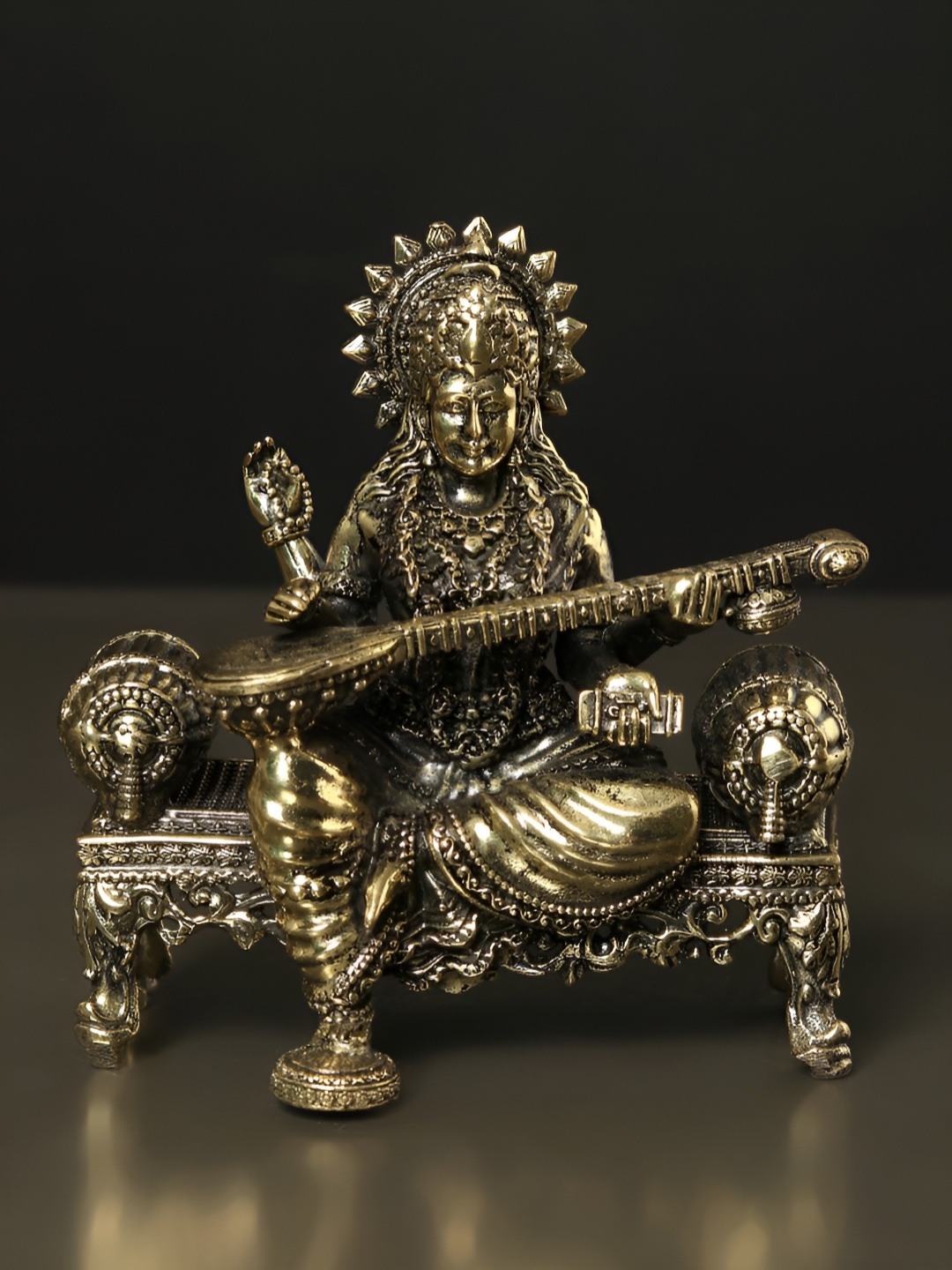 

Exotic India Brass Goddess Saraswati Idol Seated on Singhasan, Gold