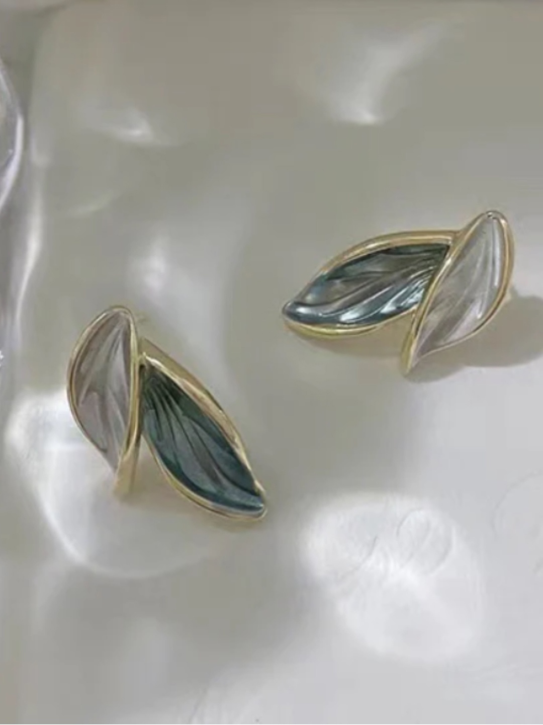 

SUBHAGALANKAR Leaf Shaped Studs Earrings, Grey