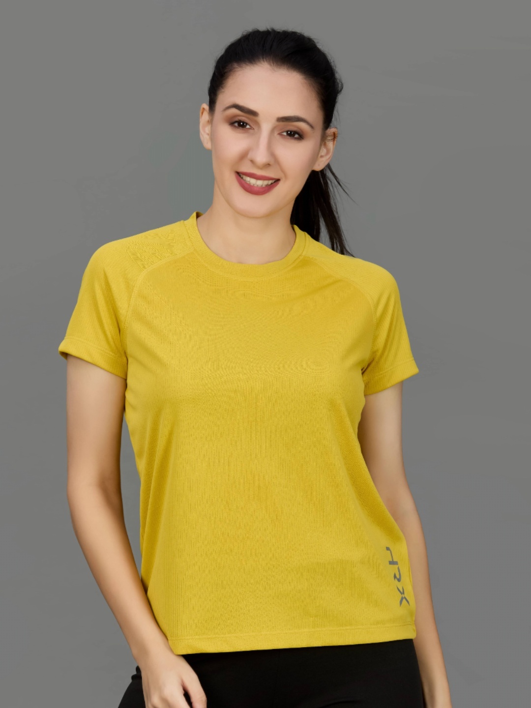 

HRX by Hrithik Roshan Women Solid Round Neck T-shirt, Yellow