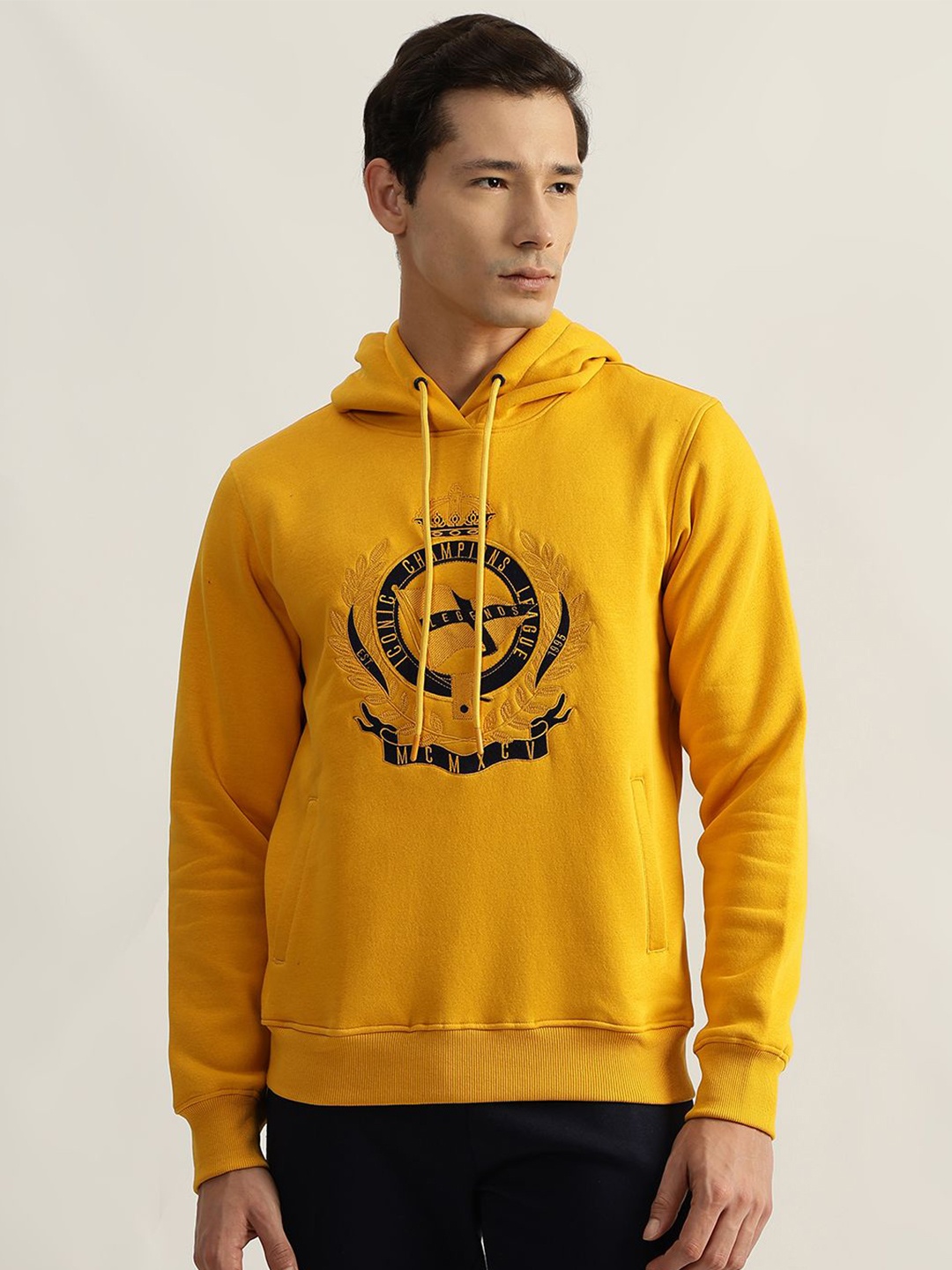 

Iconic Men Embroidered Pure Cotton Hooded Sweatshirt, Mustard