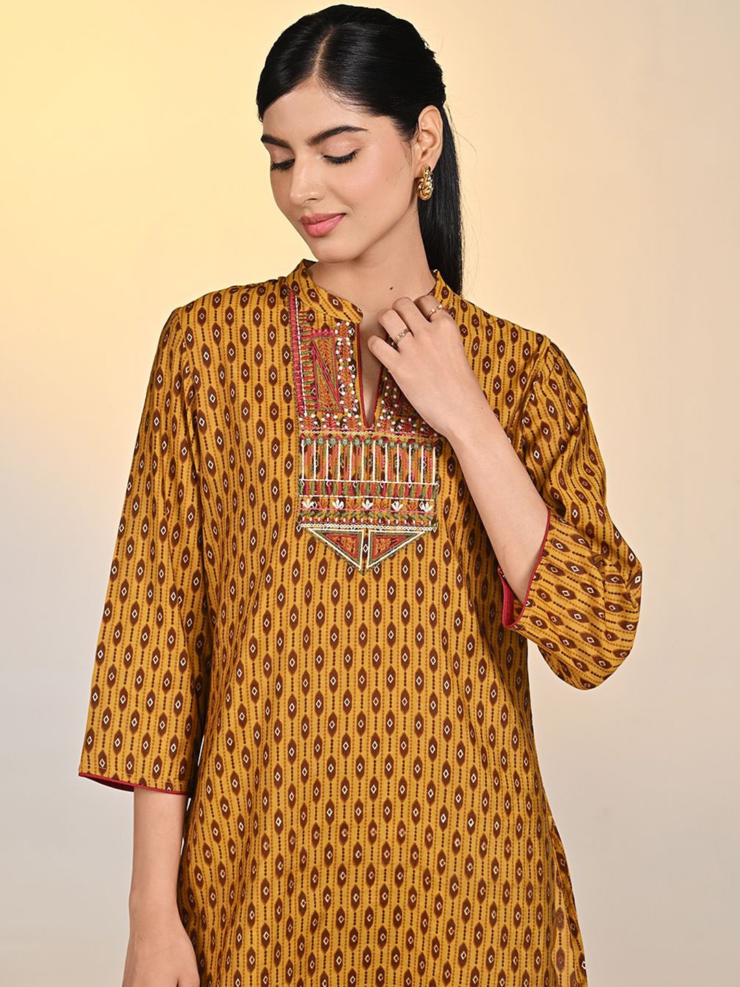

Lakshita Women Ethnic Motifs Printed Thread Work Kurti, Mustard