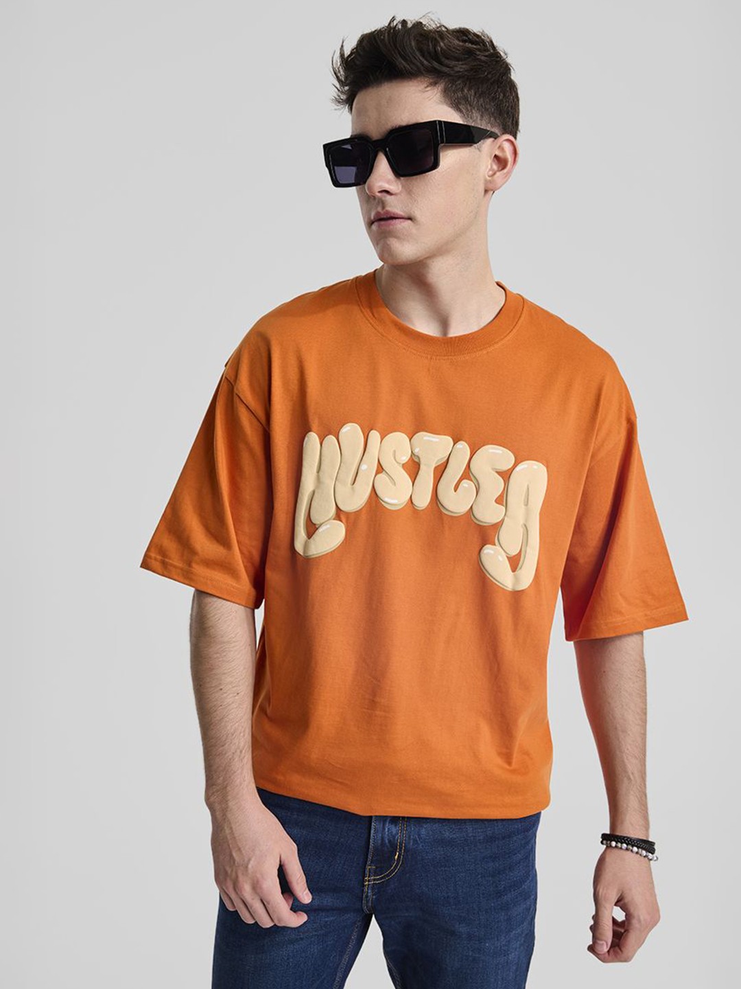 

Snitch Men Typography Printed Round Neck Cotton Oversized T-shirt, Orange