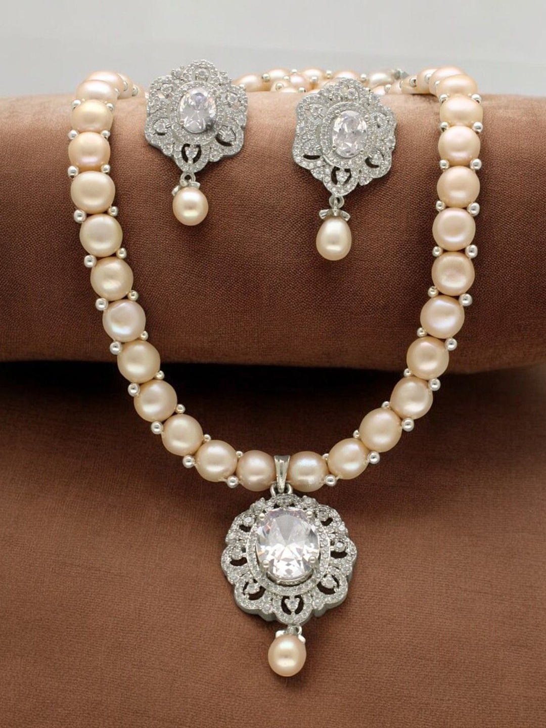 

Sri Jagdamba Pearls Dealer Silver- Plated Stone Studded & Beaded Jewellery Set