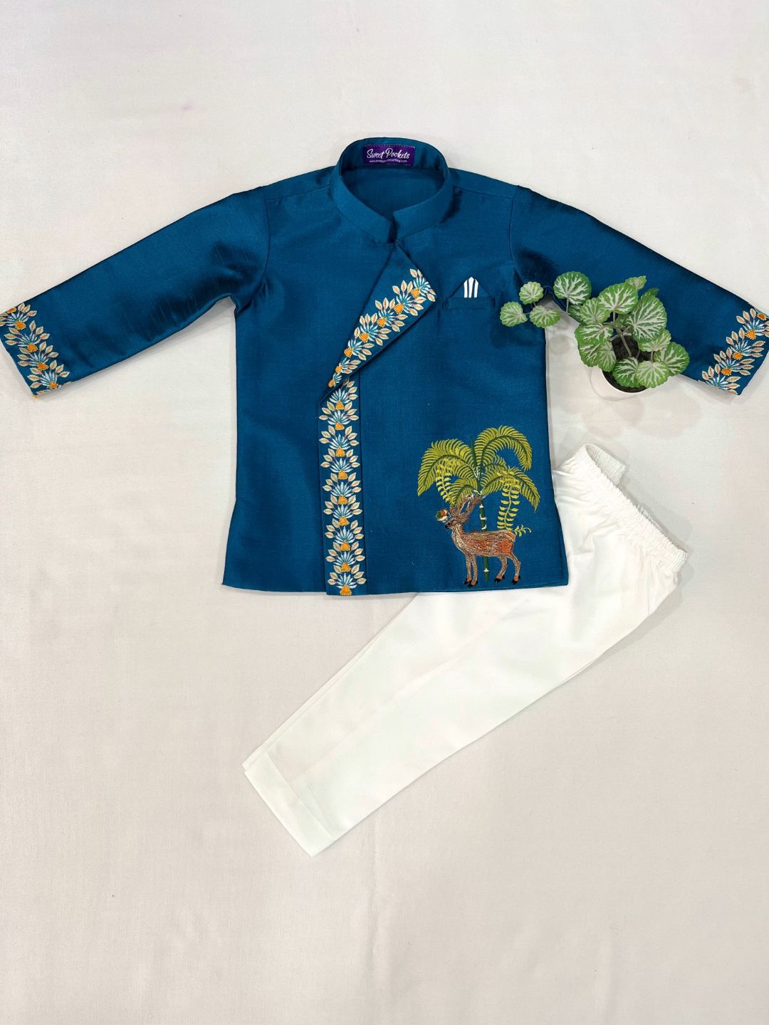 

Sweet Pockets Boys Floral Embroidered Thread Work Raw Silk Straight Kurta With Dhoti Pant, Blue