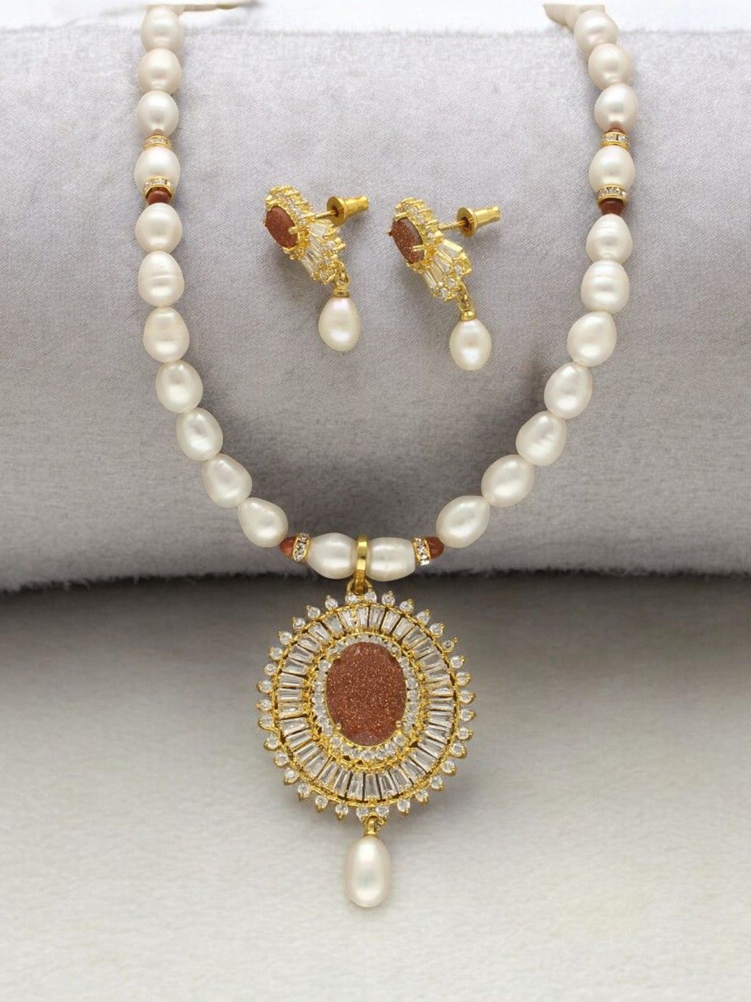 

Sri Jagdamba Pearls Dealer Gold- Plated Pearl & Stone Studded Jewellery Set