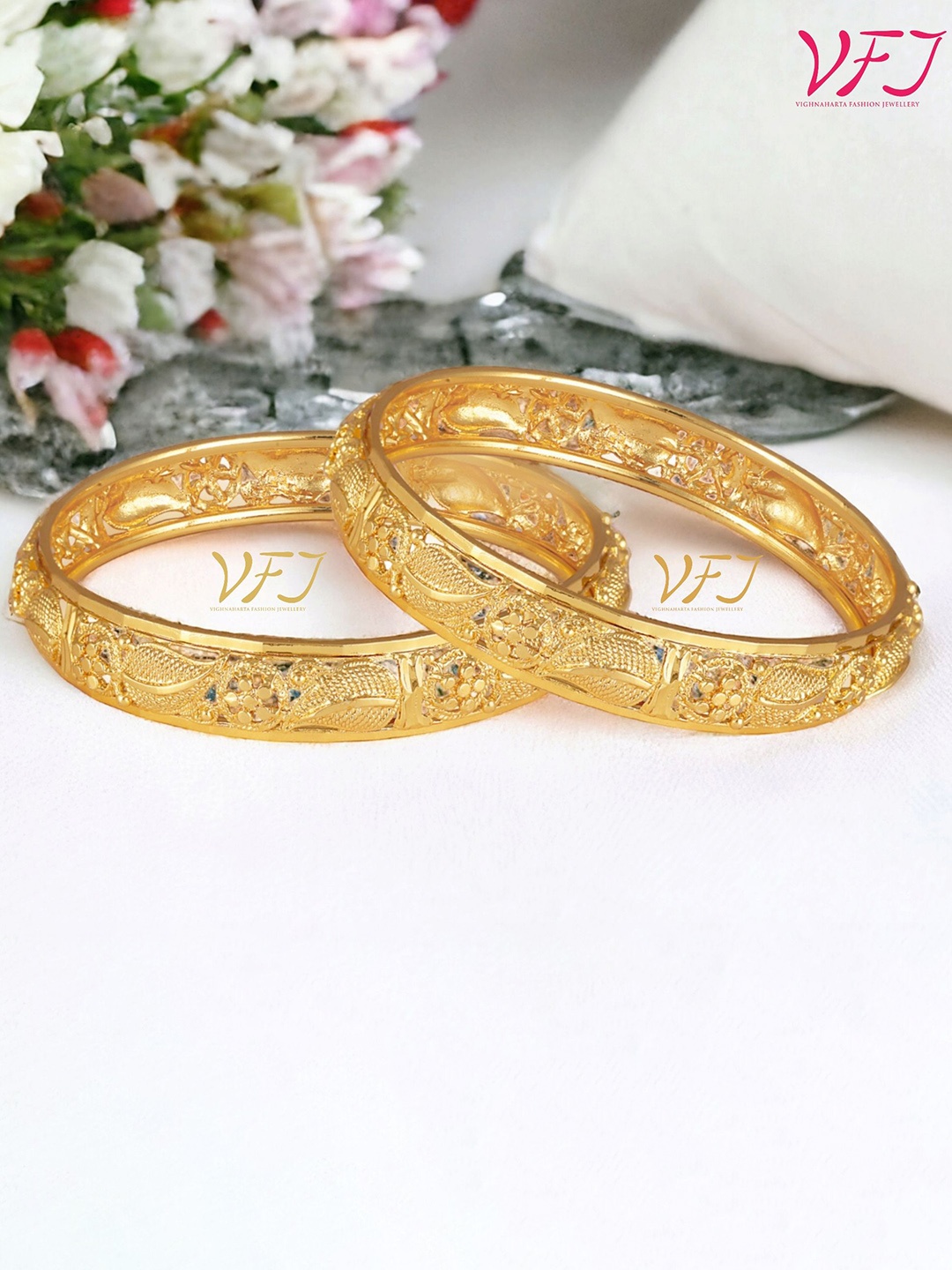

Vighnaharta Set Of 2 Gold Plated Textured Bangles