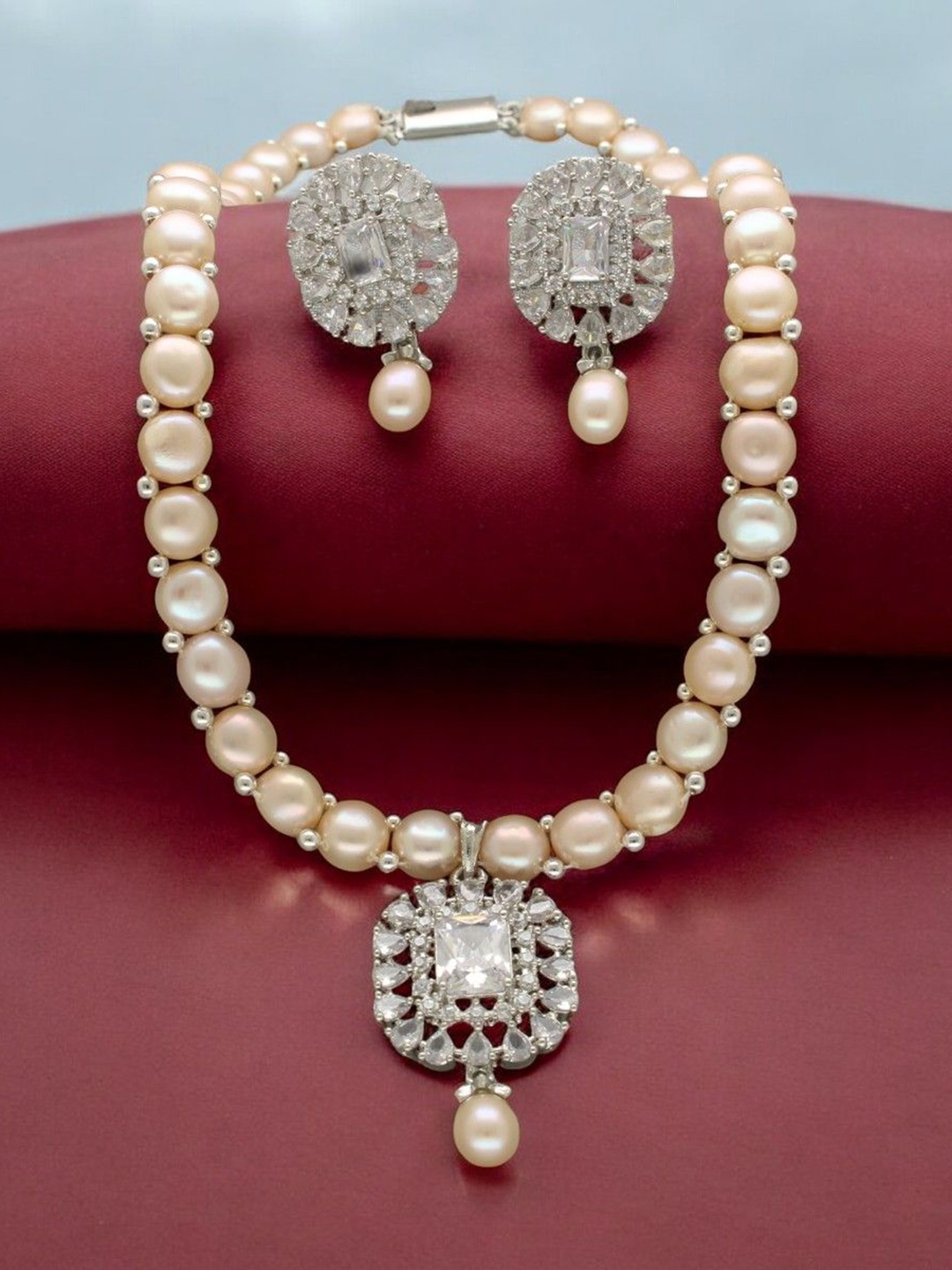 

Sri Jagdamba Pearls Dealer Silver- Plated Pearl & Stone Studded Jewellery Set