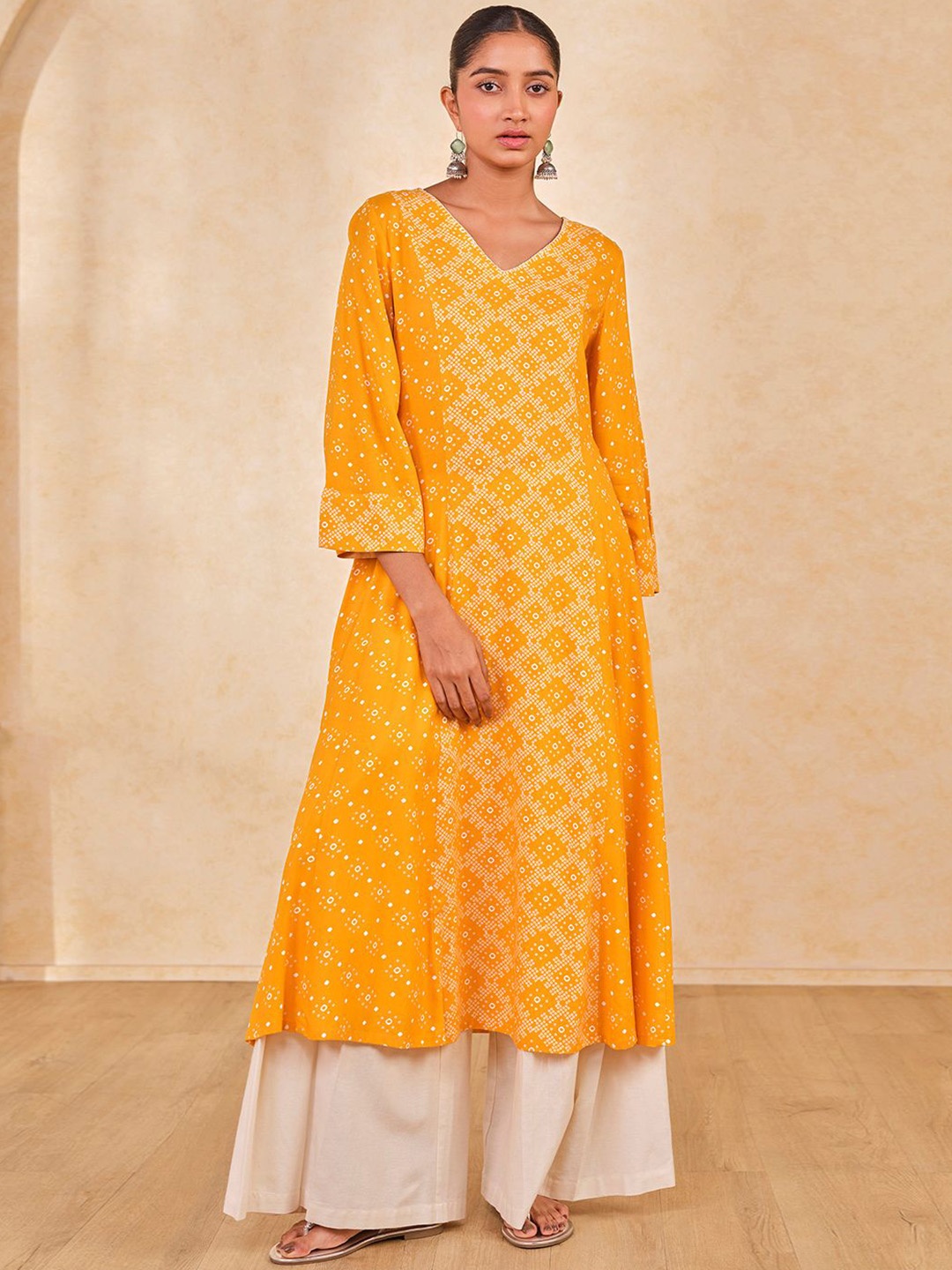 

Global Desi Ethnic Motifs V-Neck A-Line Kurta, Mustard