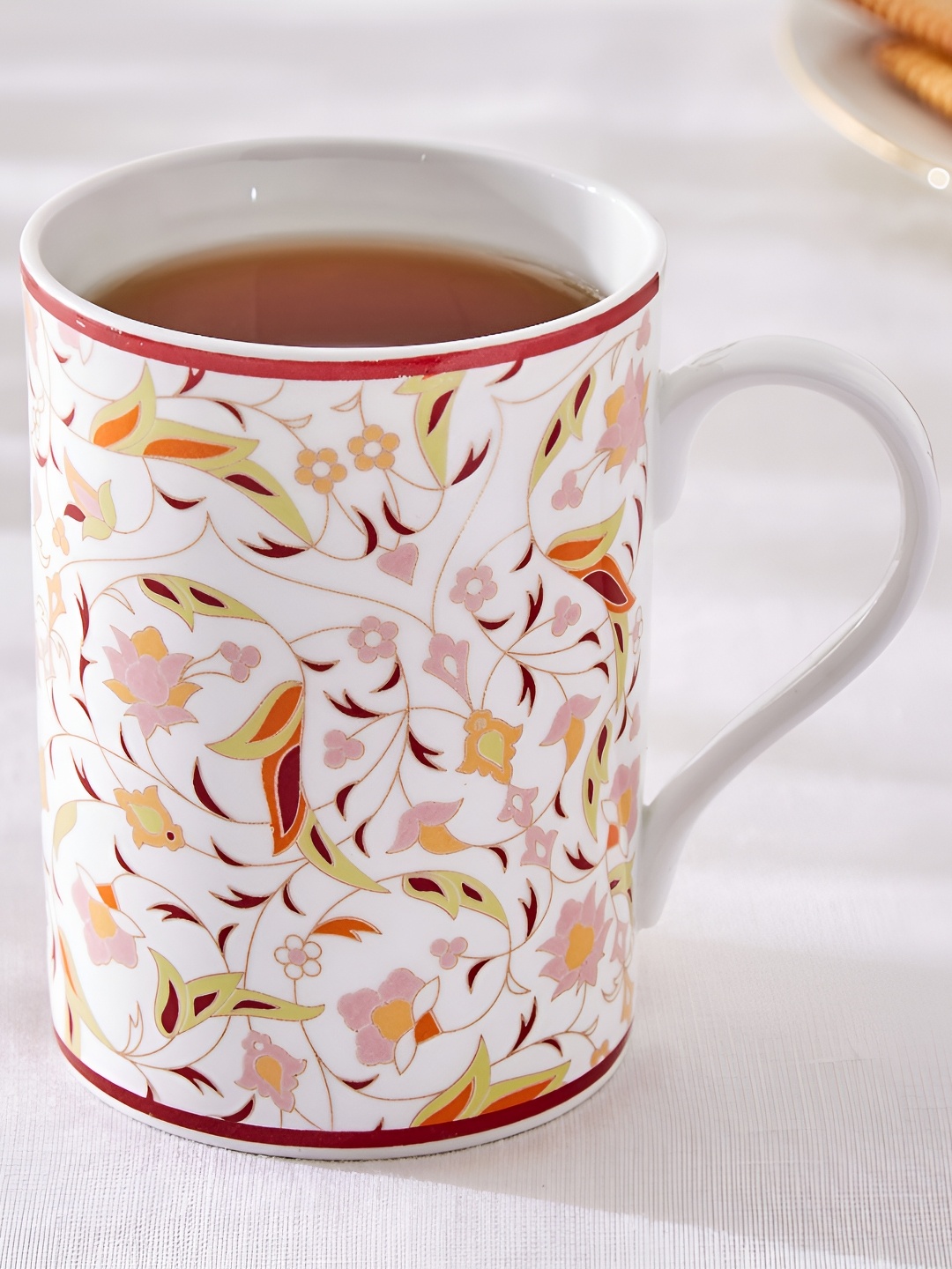 

Home Centre White & Yellow Floral Printed Bone China Glossy Mugs Set of Cups and Mugs