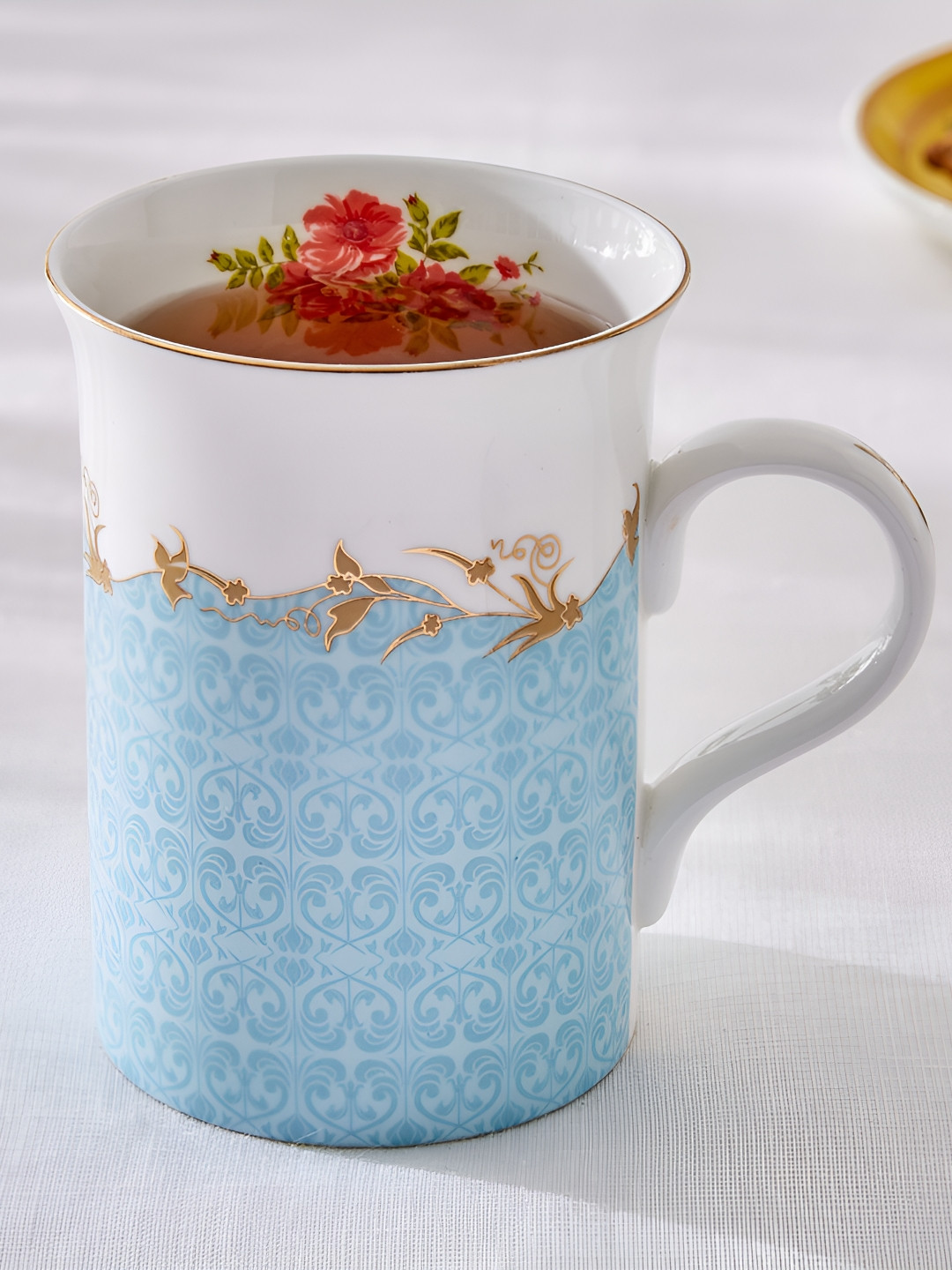 

Home Centre Blue & White Floral Printed Glossy Mug 370ml