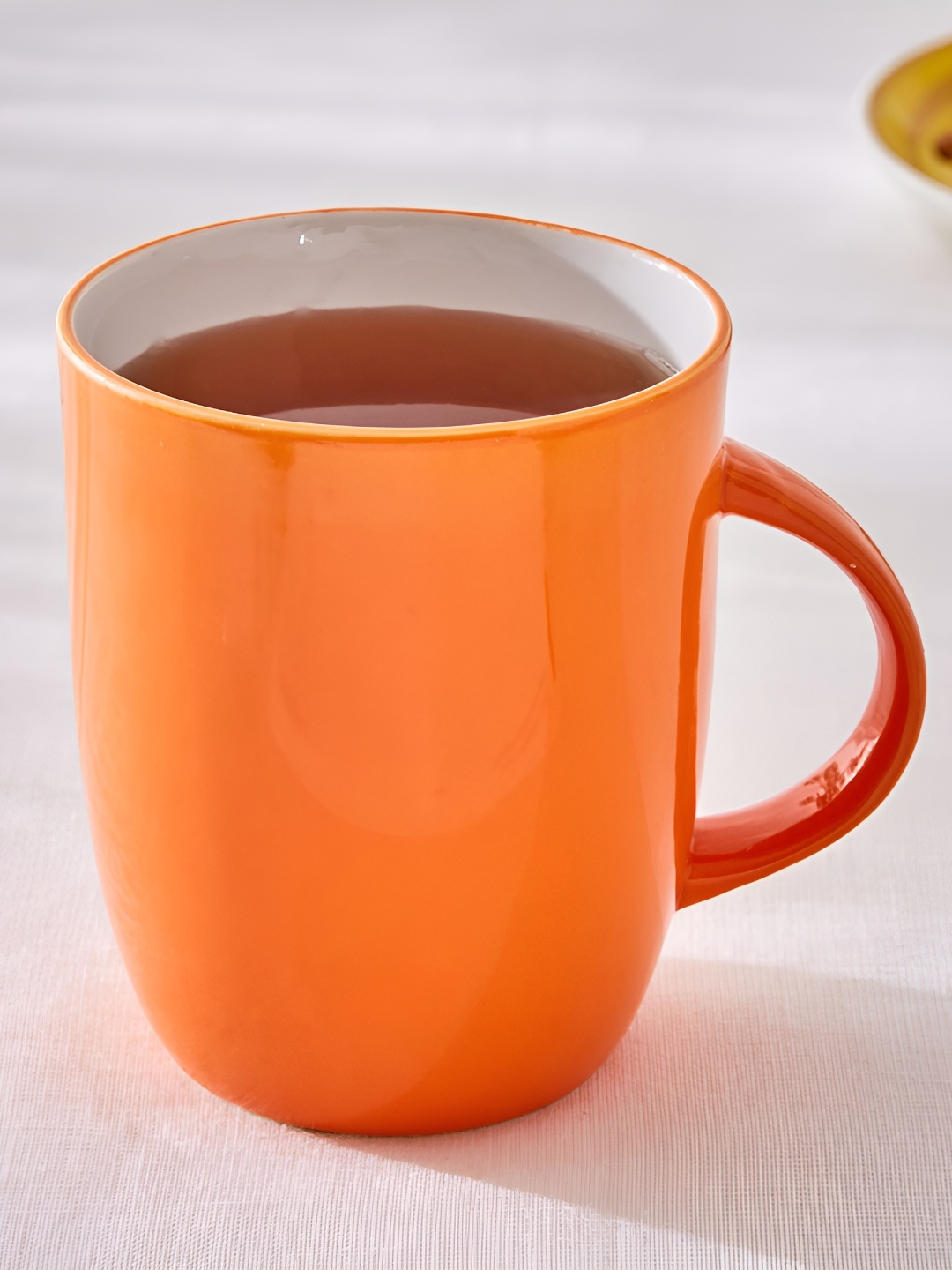 

Home Centre Orange Solid Bone China Glossy Mugs Set of Cups and Mugs