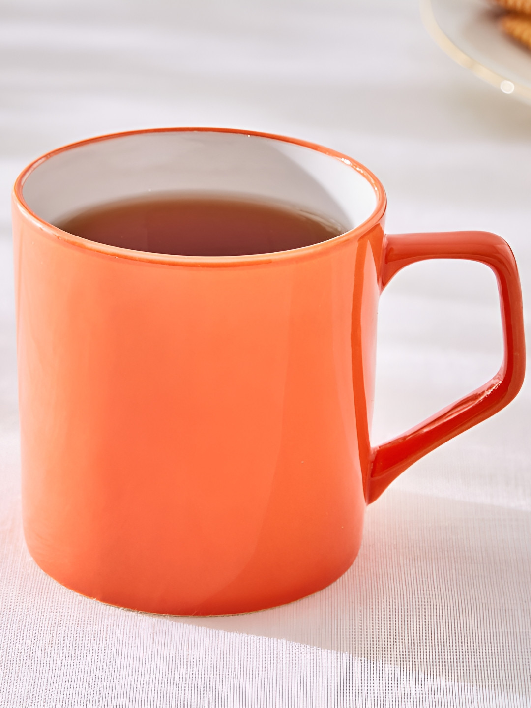 

Home Centre Orange Solid Bone China Glossy Mugs Set of Cups and Mugs