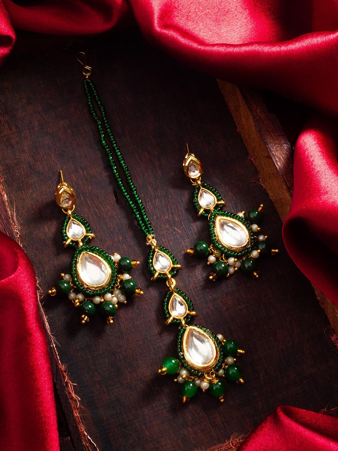 

Aadita Gold Plated Kundan Studded Maang Tika and Earrings