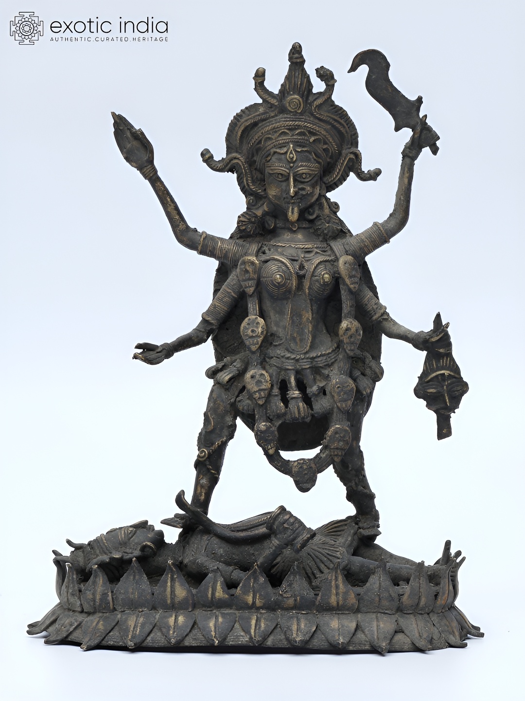 

Exotic India 9" Brass Maa Kali Standing on Lord Shiva Tribal Statue, Black