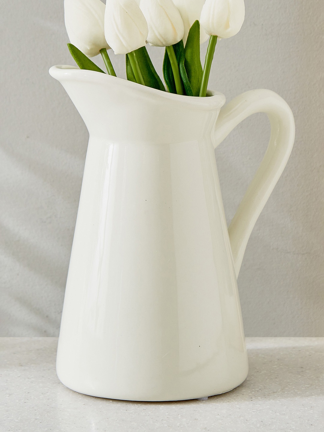 

Home Centre Gloria White Ceramic Jug Flower Planter