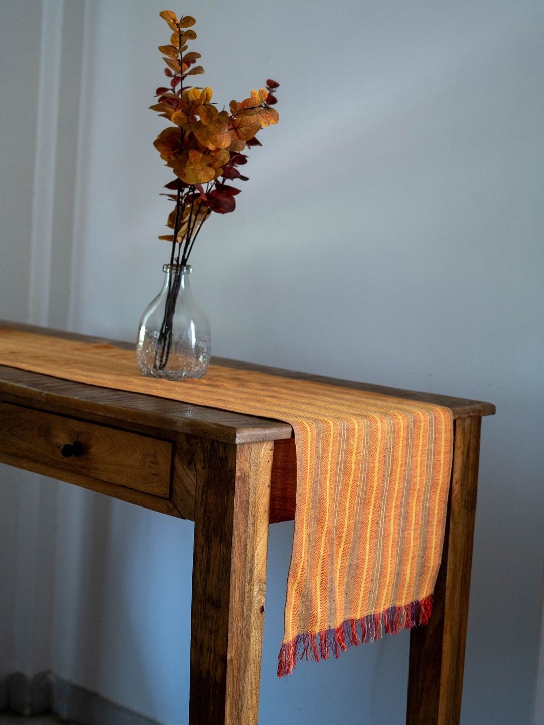 

Ratan Cart Orange-Coloured & Red Striped Pure Cotton Rectangular Table Runner