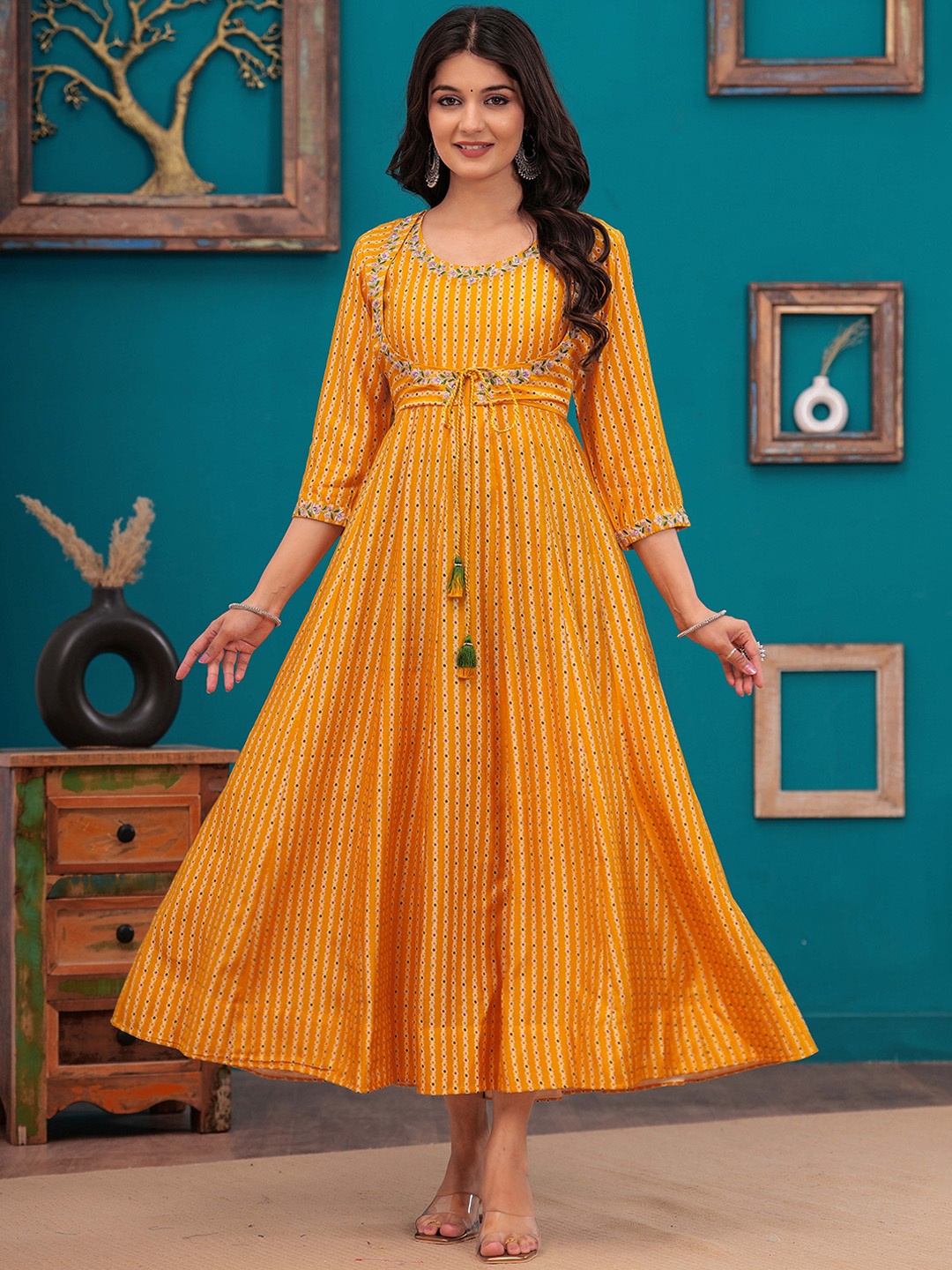 

Meeranshi Women Embroidered Flared Maxi Ethnic Dresses, Mustard