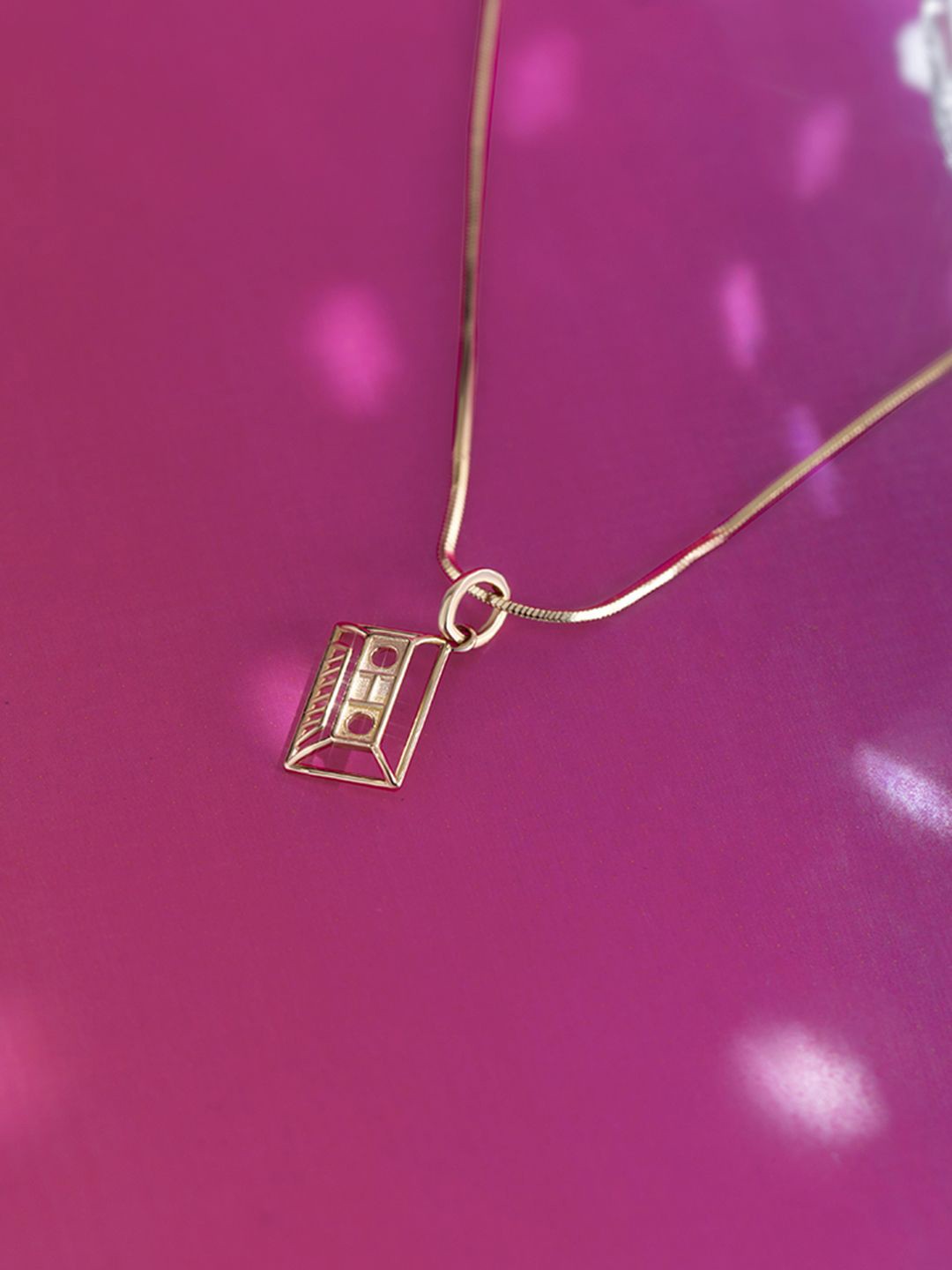 

Mia by Tanishq 14KT BIS Hall Mark Cassette Charm Gold Pendant-0.69 gm, Yellow