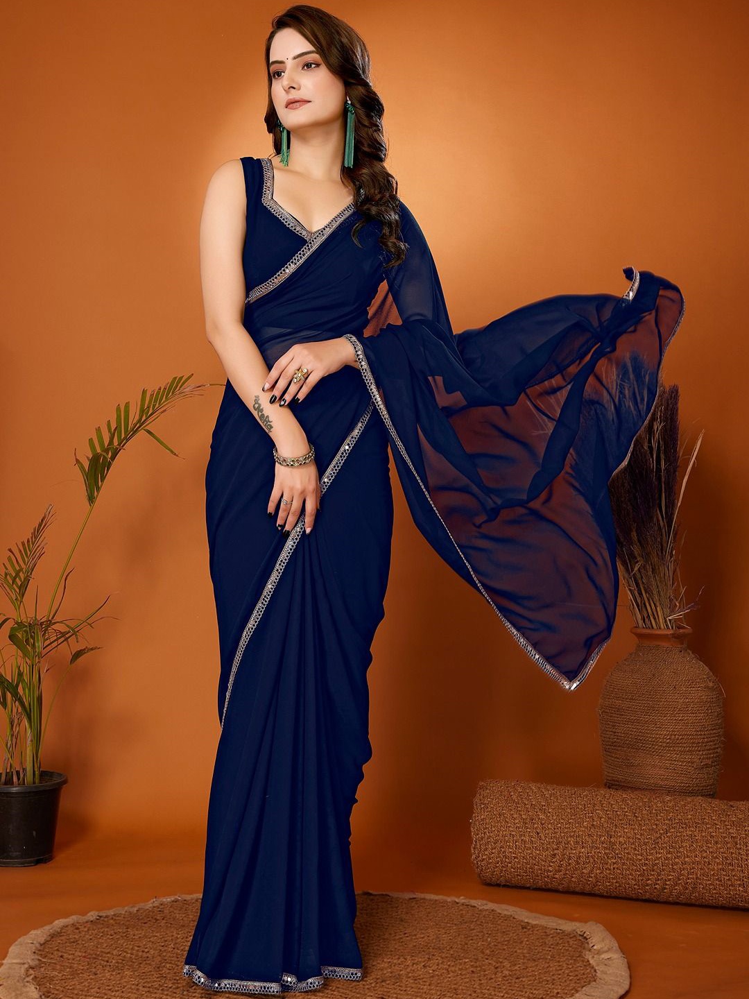 

FABMORA Embellished Sequinned Pure Georgette Saree, Navy blue