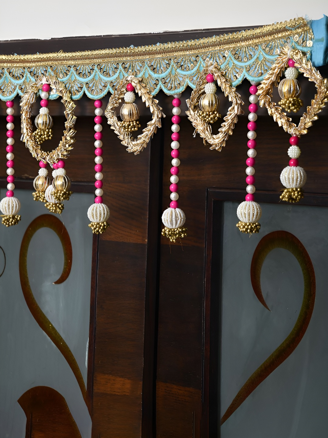 

Aapno Rajasthan Gold Toned & Blue Embroidered Beaded Door Toran