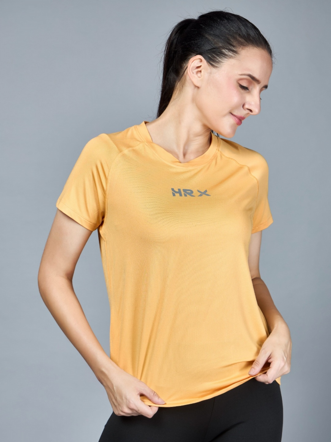 

HRX by Hrithik Roshan Women Solid Round Neck T-shirt, Yellow