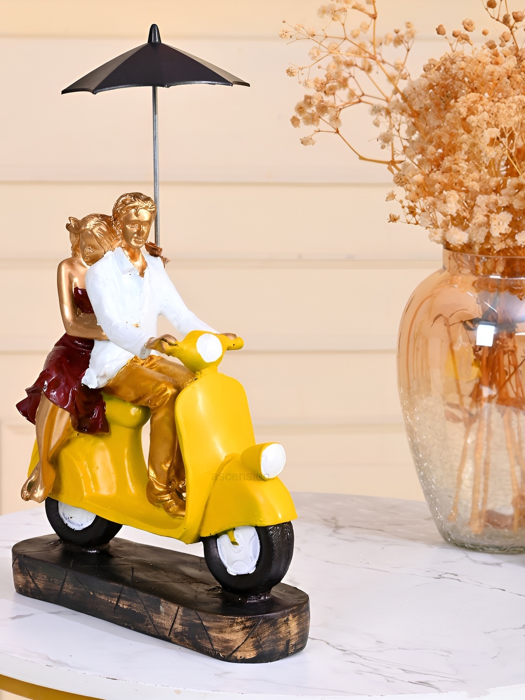 

Ascension Yellow & White Couple On Scooter With Umbrella Figurine Showpiece