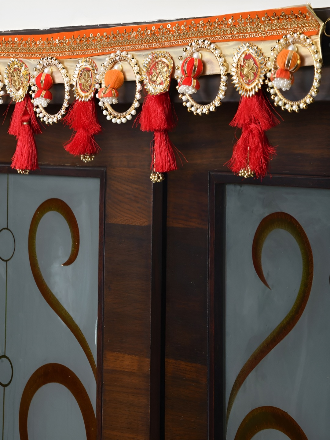 

Aapno Rajasthan Red & Beige Embroidered Beaded Door Toran