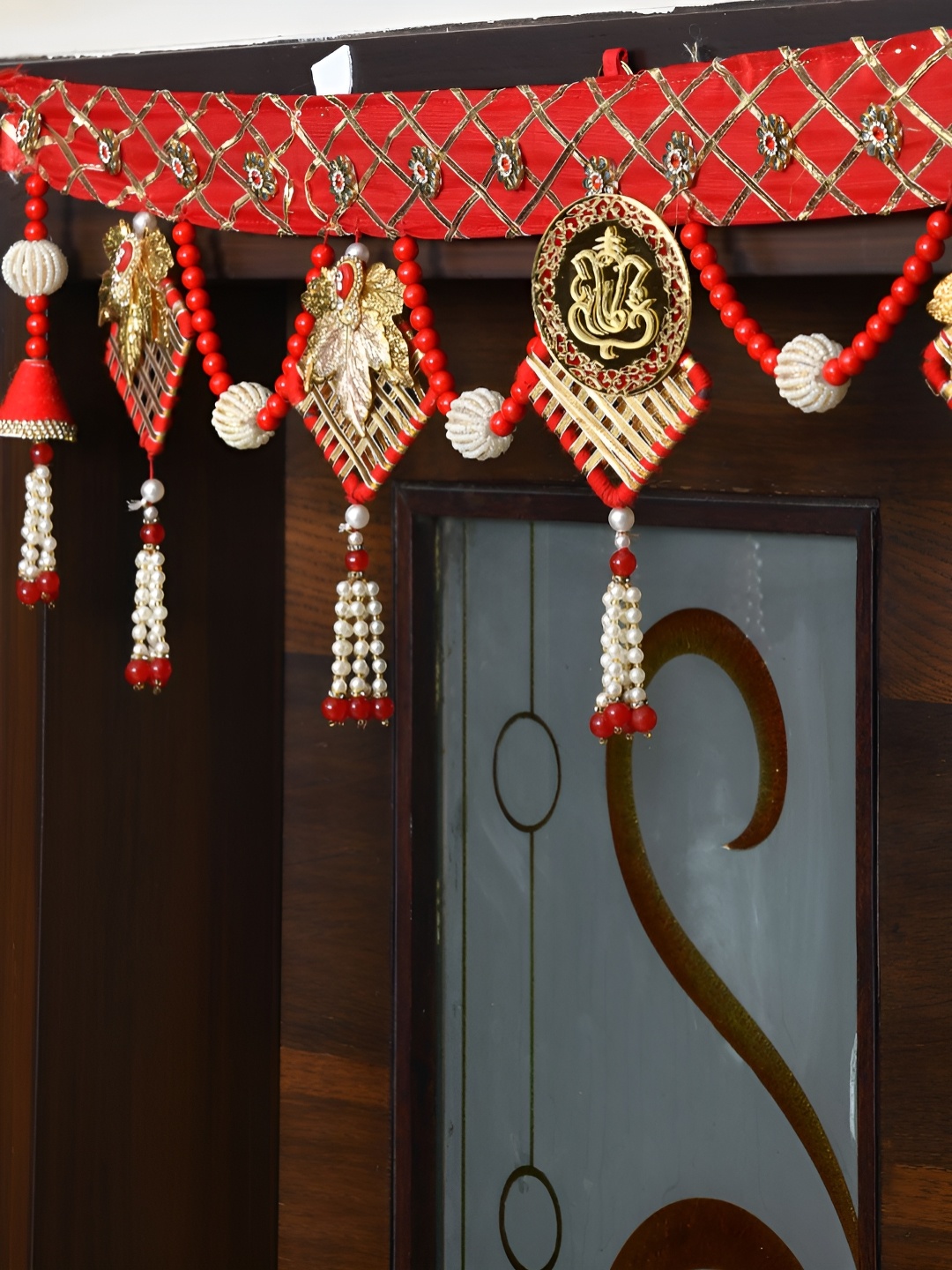 

Aapno Rajasthan Gold Toned & Red Beaded Door Toran