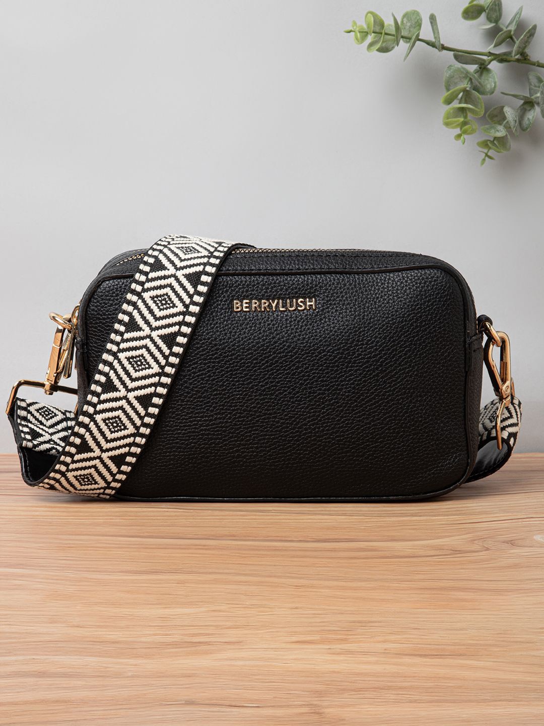 

Berrylush Women Textured Solid Structured Sling Bag, Black