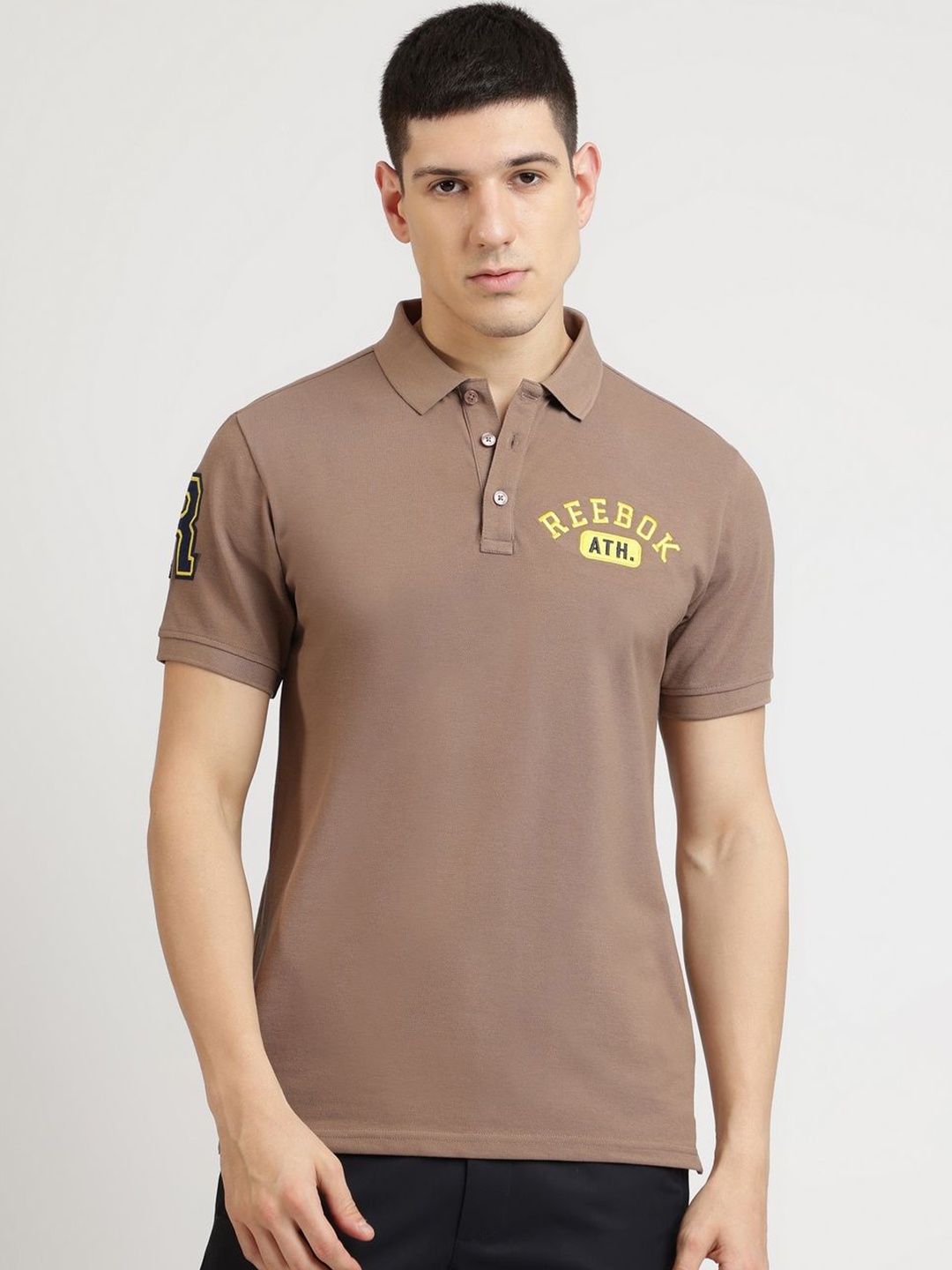 

Reebok Men Typography Printed Polo Collar Cotton T-shirt, Brown