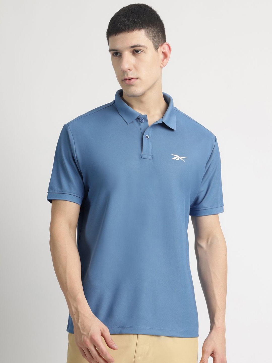 

Reebok Men Solid Polo Collar T-shirt, Blue