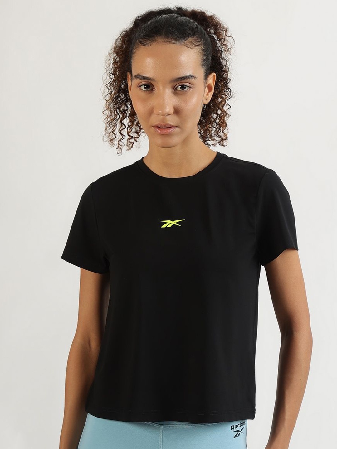 

Reebok Women Solid Round Neck T-Shirt, Black