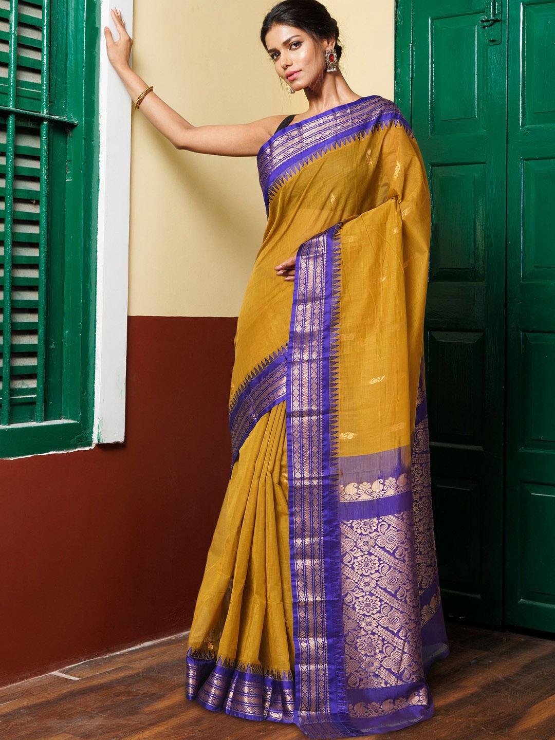 

Unnati Silks Ethnic Motifs Woven Design Zari Pure Cotton Handloom Gadwal Saree, Mustard