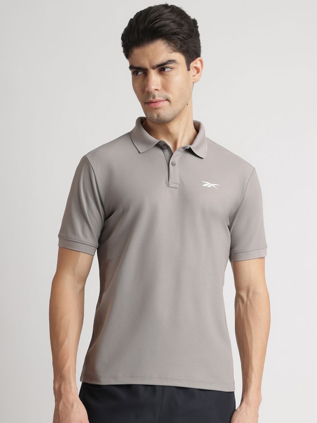 

Reebok Men Solid Polo Collar T-shirt, Grey