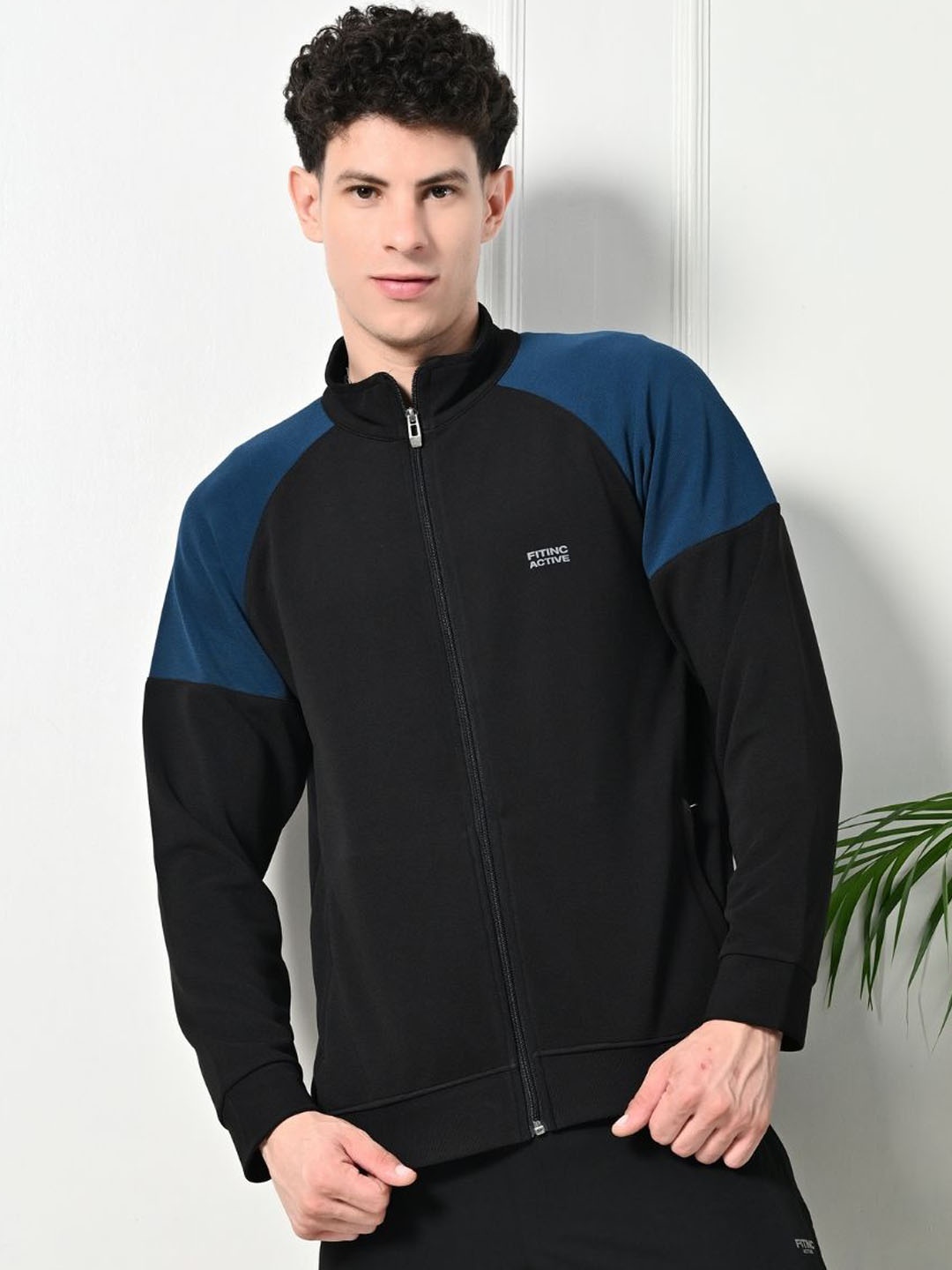 

FITINC Men Colourblocked Training or Gym Jacket, Black