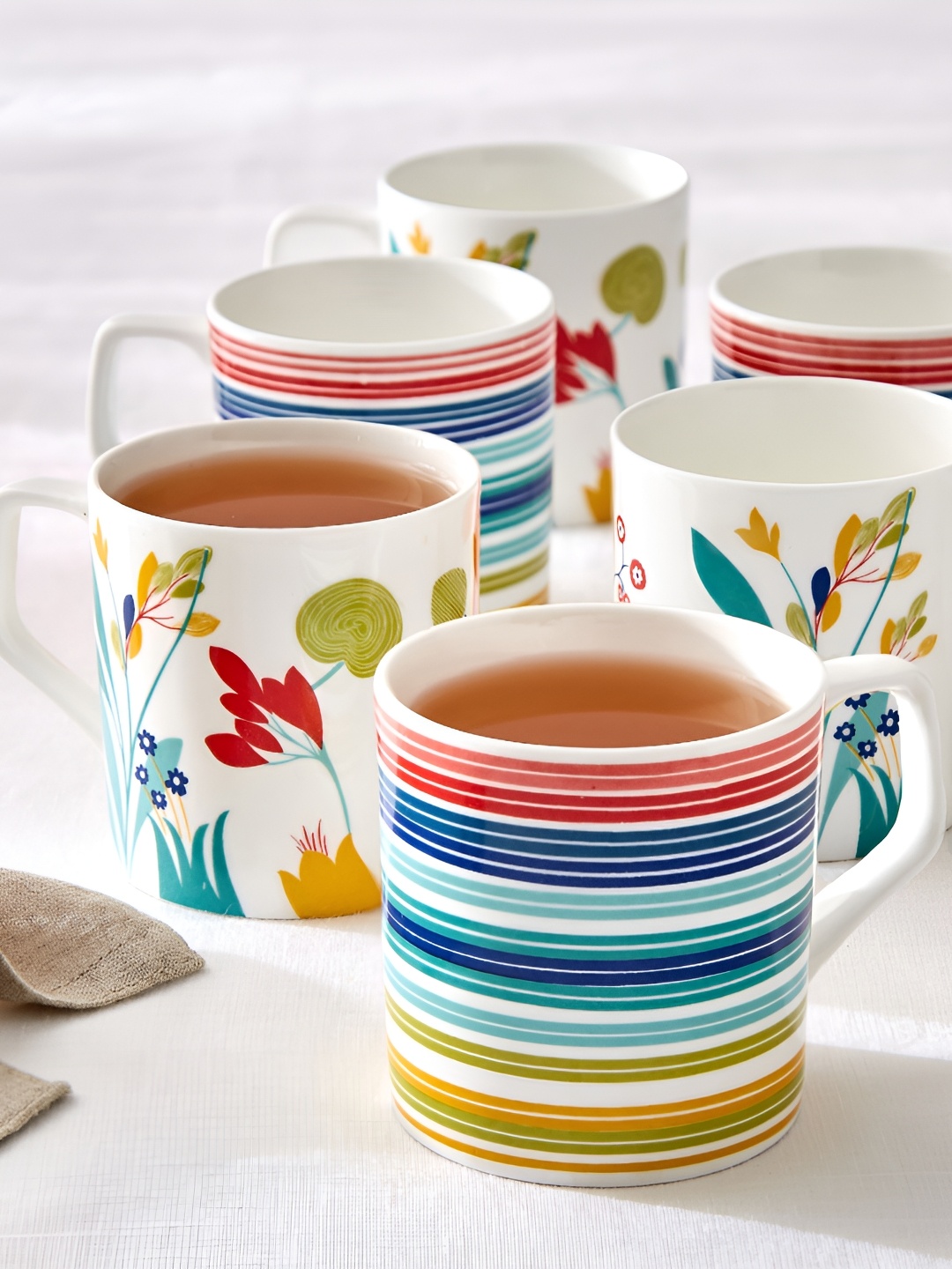 

Home Centre White & Blue Floral Printed Bone China Glossy Mugs Set of Cups and Mugs