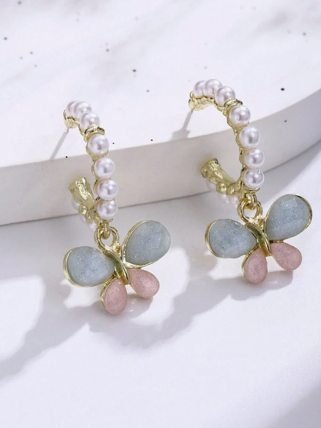 

SUBHAGALANKAR Brass-Plated Butterfly Shaped Pearls & Stone Studded Studs, Pink
