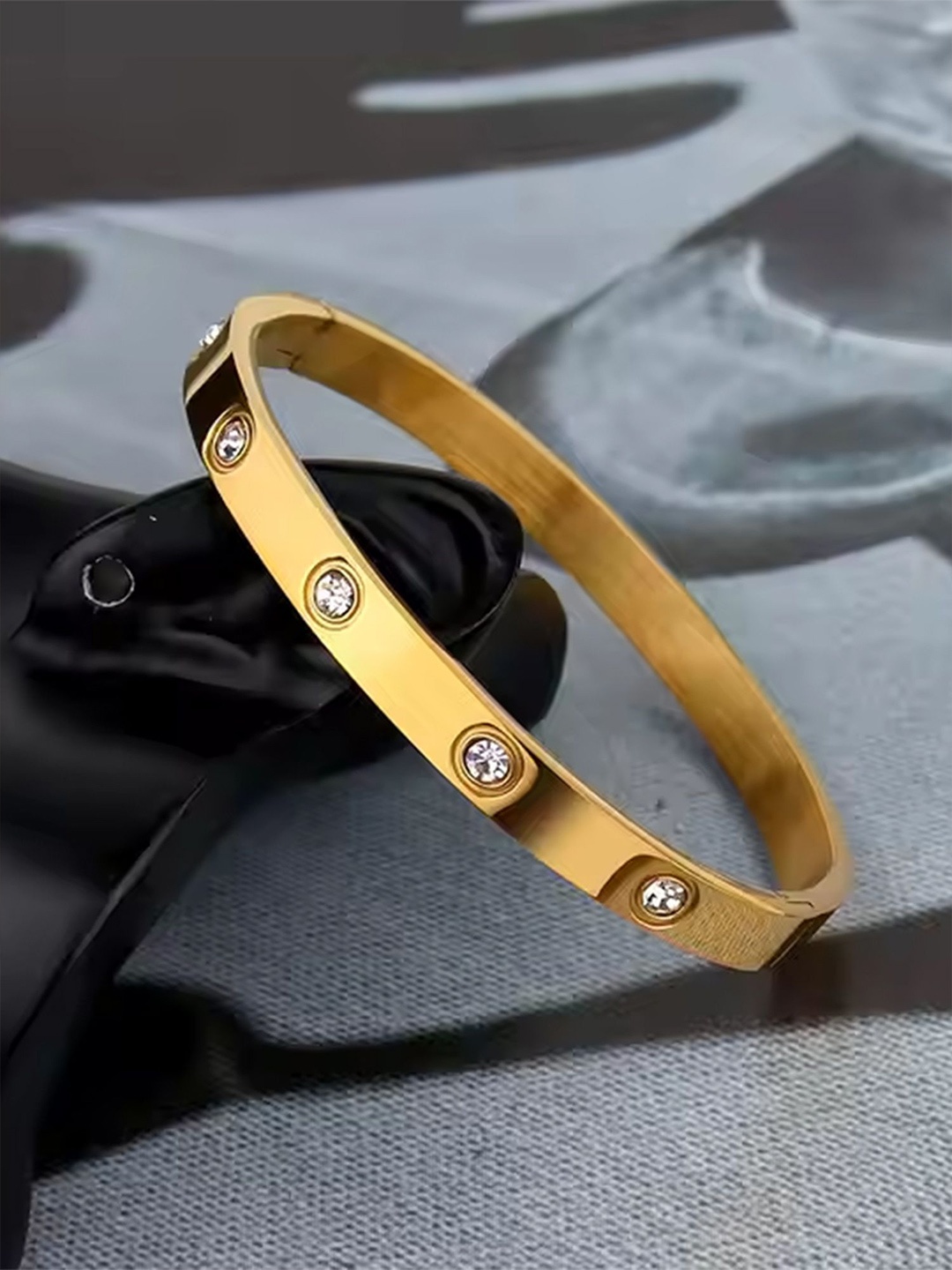 

Bohey by KARATCART Stainless Steel Cubic Zirconia Gold-Plated Kada Bracelet
