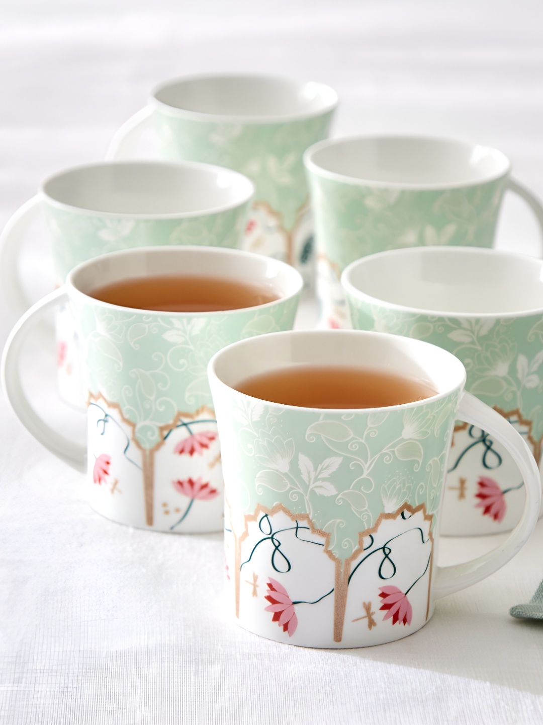 

Home Centre Green & White Ethnic Motifs Printed Bone China Glossy Mugs Set of Cups and Mugs