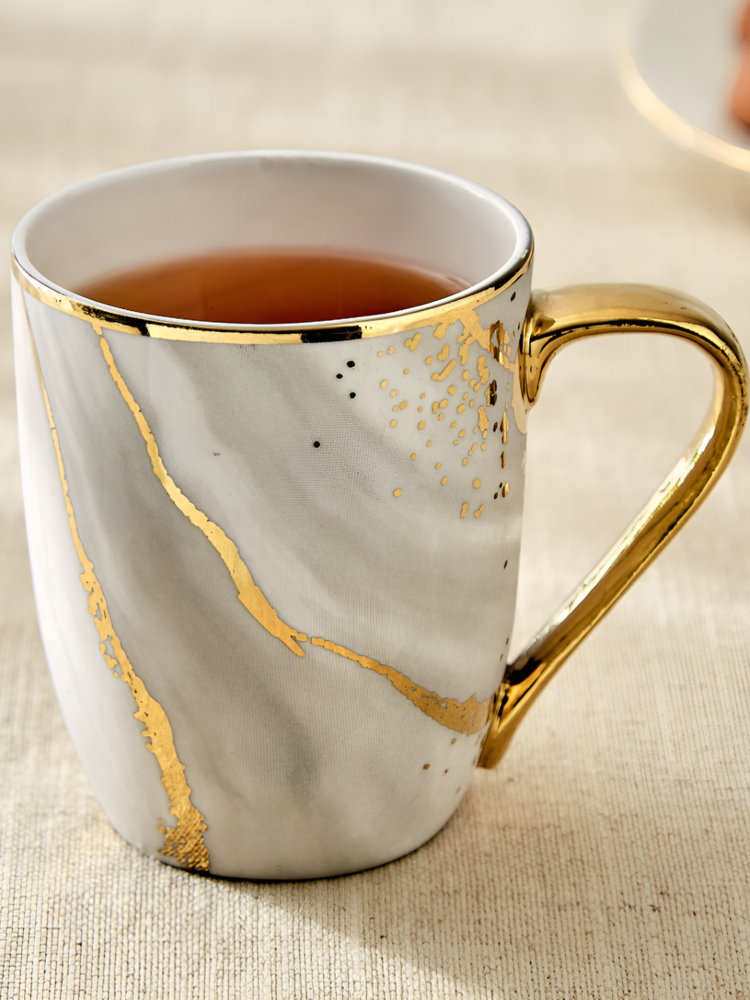 

Home Centre Grey & Gold-Toned Geometric Printed Bone China Glossy Mugs Set of Cups and Mugs