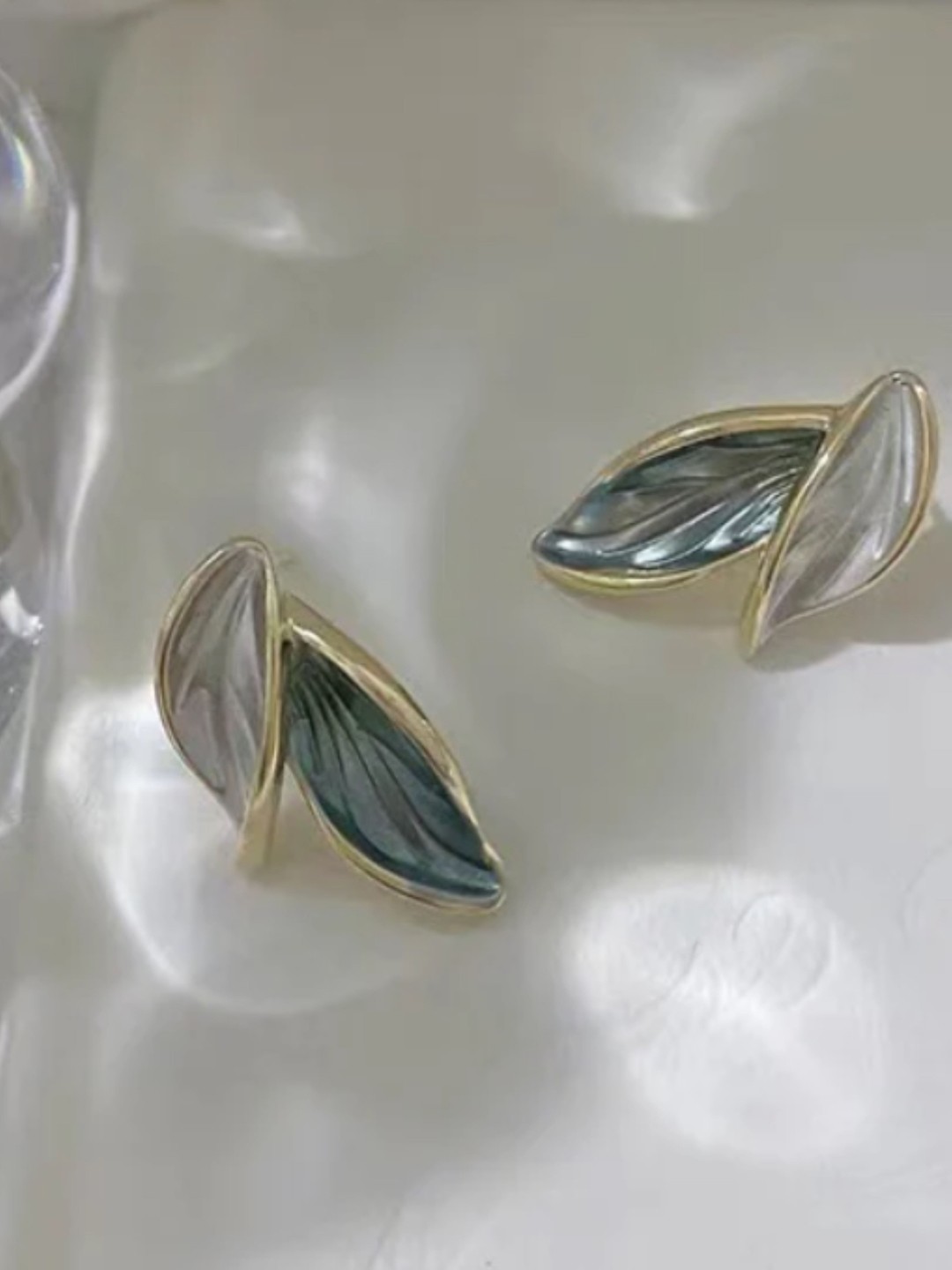 

SUBHAGALANKAR Leaf Shaped Studs Earrings, Grey